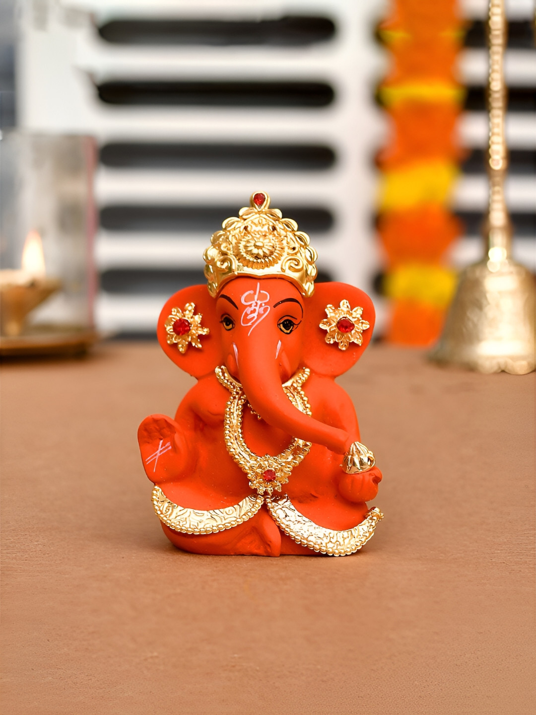 CraftVatika Orange Small Religious Ganesh Idol Showpiece