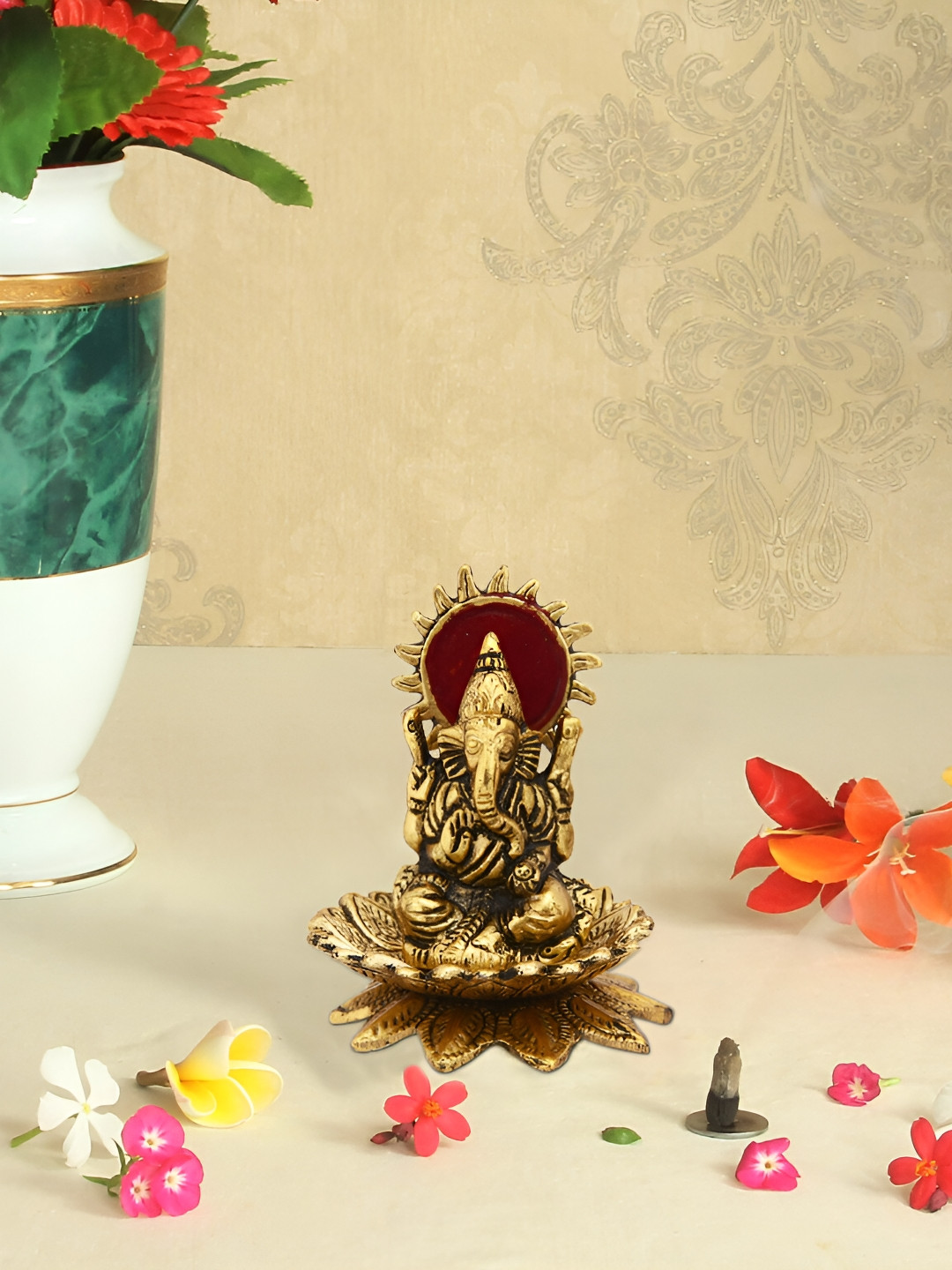 HANDICRAFTS PARADISE Lord Ganesh on Flower Gold Metal Metallic Prayer Room Medium Showpiece - 3.2 Inches