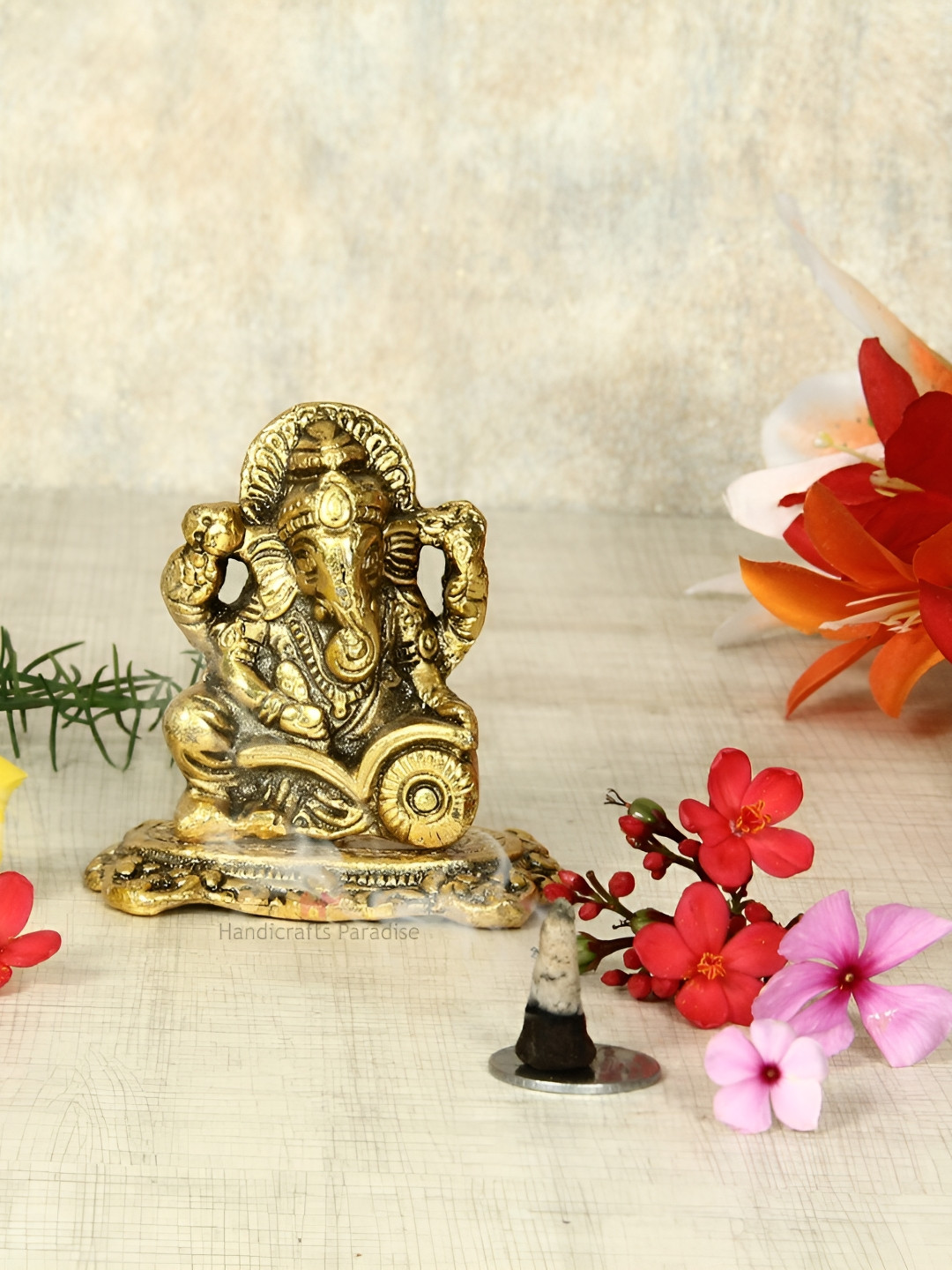 HANDICRAFTS PARADISE Lord Ganesha Reading Ramayana Gold Metal Metallic Living Room Medium Showpiece - 2 Inches