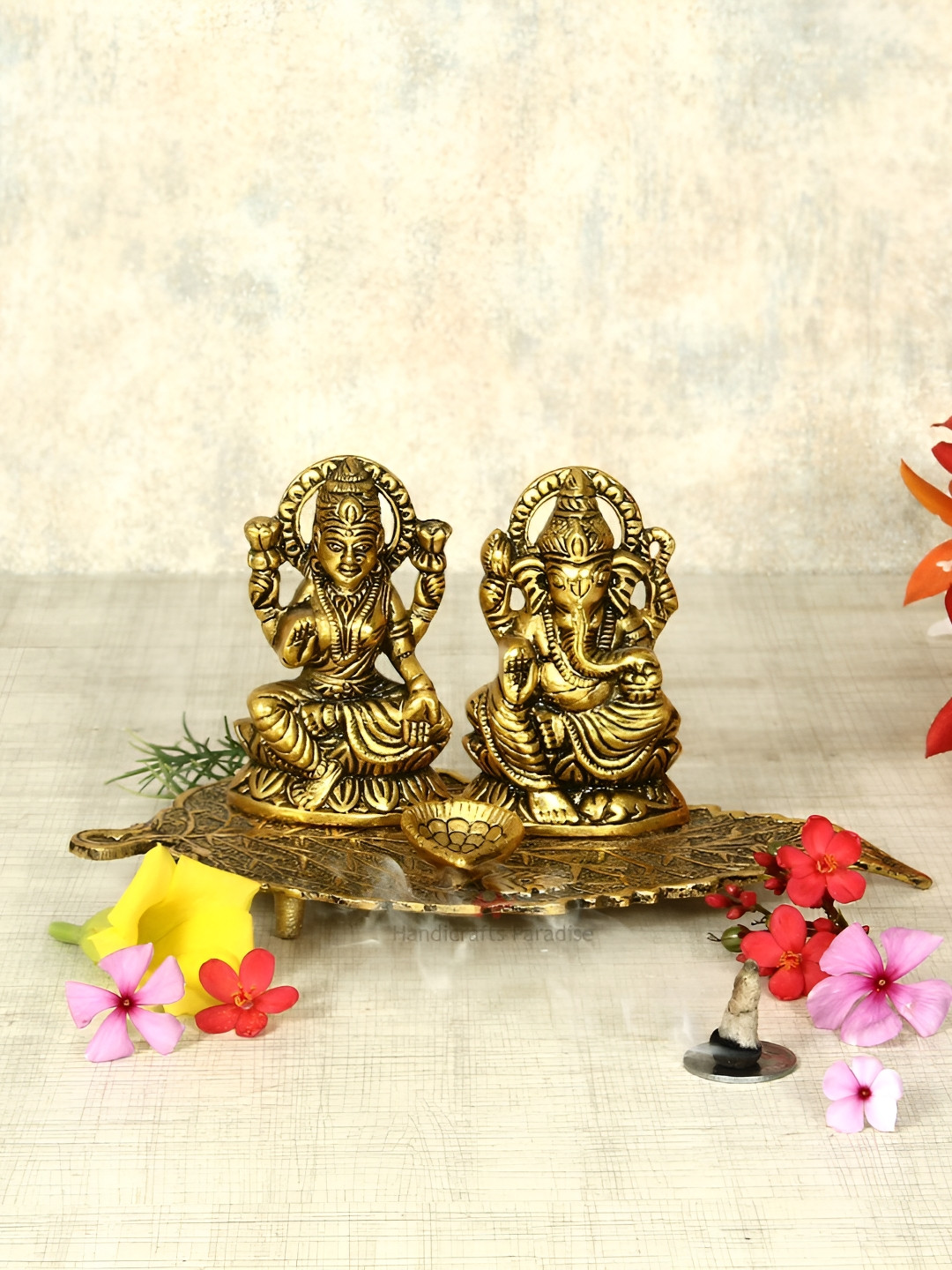 HANDICRAFTS PARADISE Laxmi Ganesh on Leaf with Diya Gold Metal Metallic Prayer Room Small Showpiece - 4.3 Inches