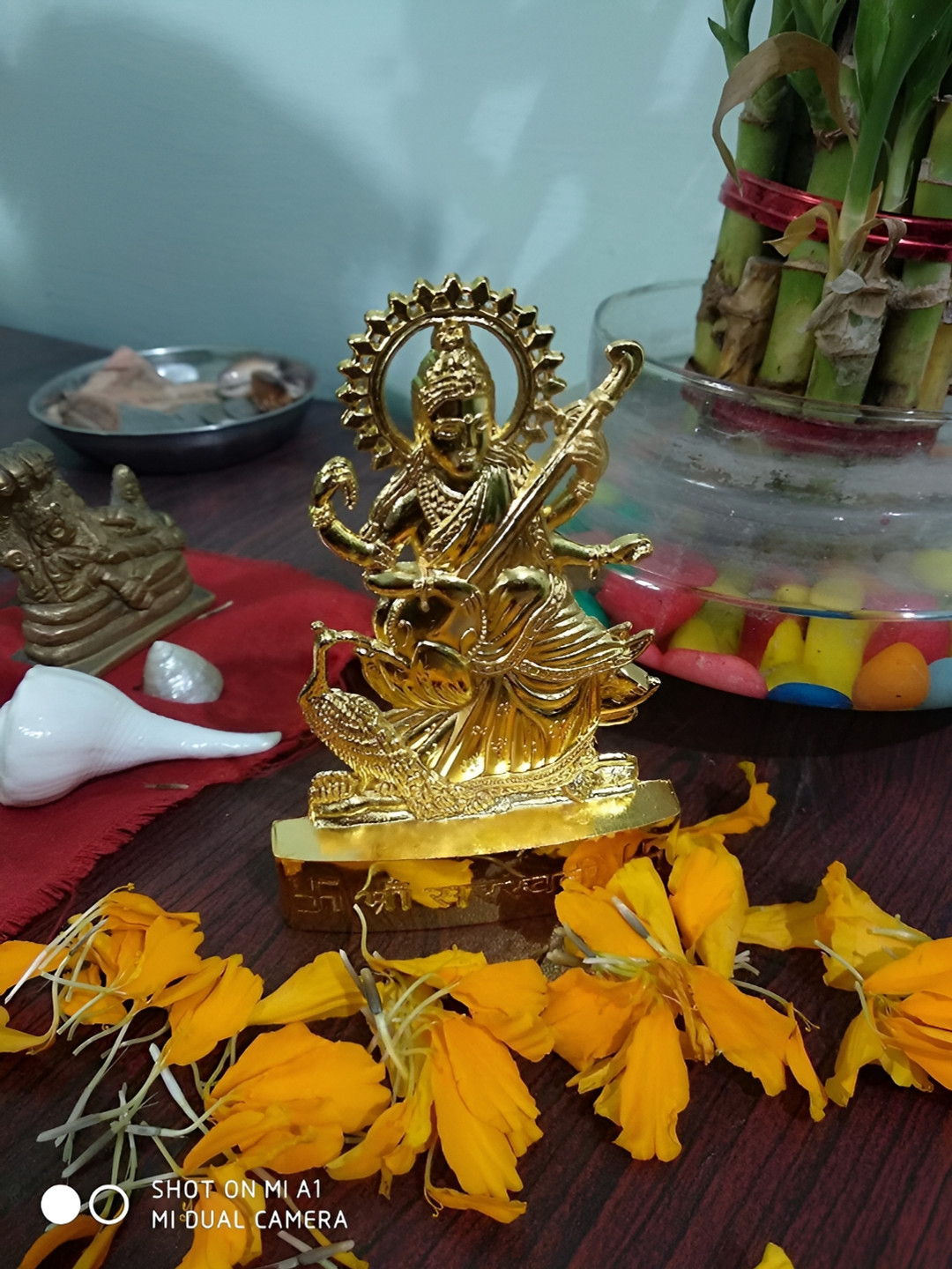 Navyaksh Saraswati Yellow Metal Metallic Prayer Room Small Showpiece -