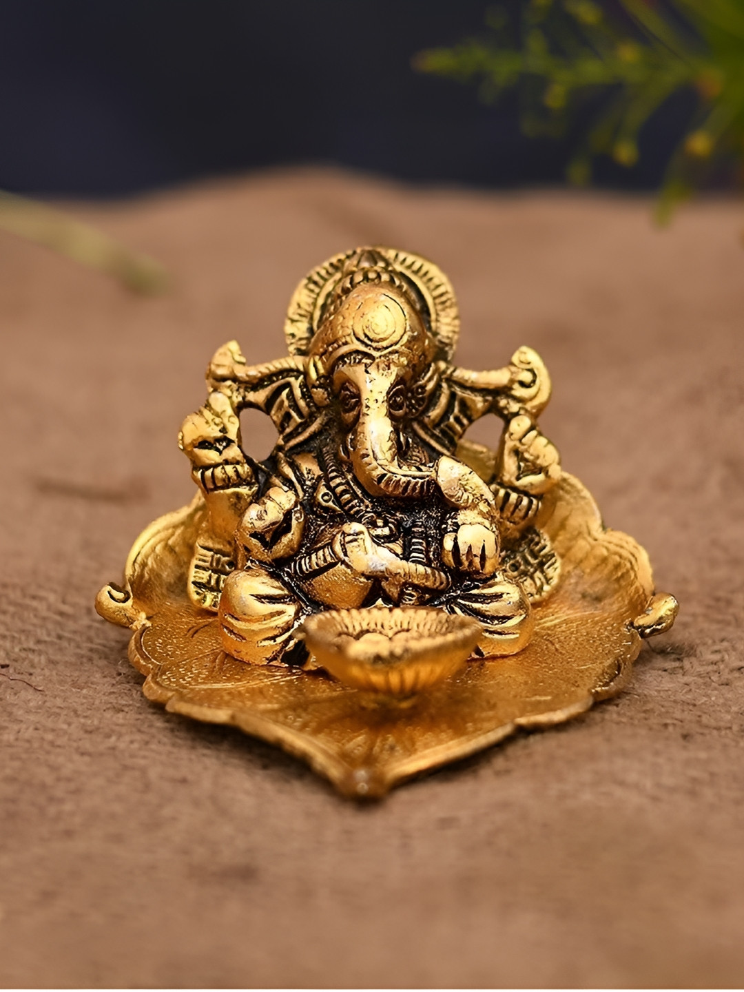 Navyaksh Ganesh Ji with Diya Gold Aluminium Metallic Prayer Room Small Showpiece - 3 Inches
