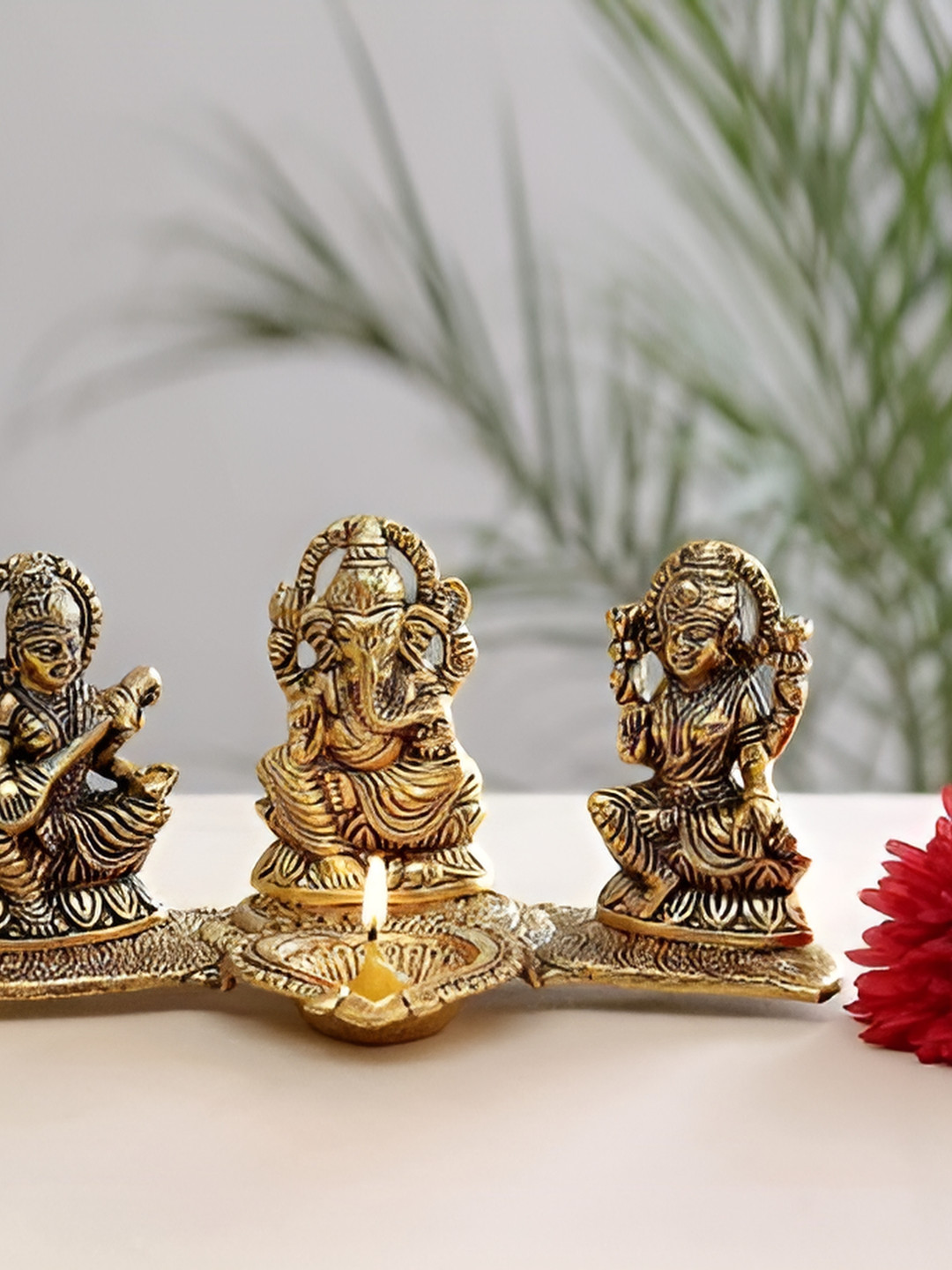 Navyaksh Laxmi Gnaesh Saraswati Diya Gold Metal Metallic Prayer Room Small Showpiece - 3.9 Inches