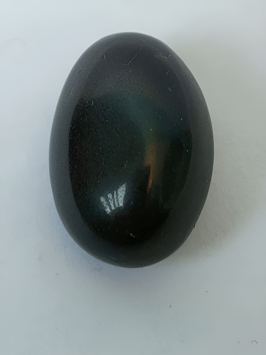 Navyaksh Pathar Shaligram Black Stone Natural Living Room Tiny Showpiece - 1.6 Inches