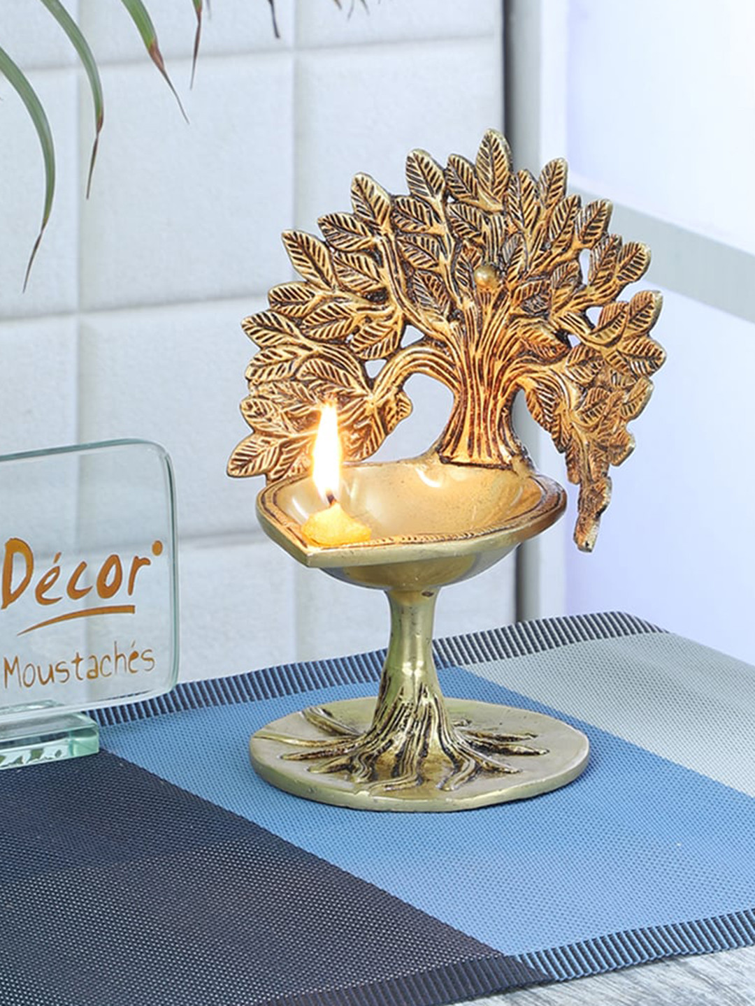 Two Moustaches Gold Toned Brass Diya Under Bodhi Tree