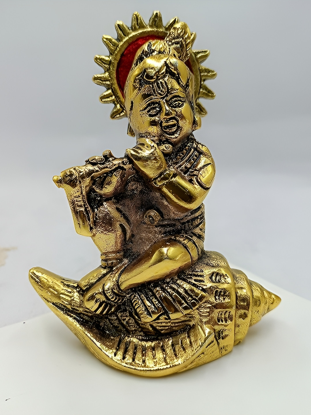 CraftVatika Krishna Laddu Gopal Sitting on Conch Gold Brass Metallic Prayer Room Medium Showpiece - 4.2 Inches