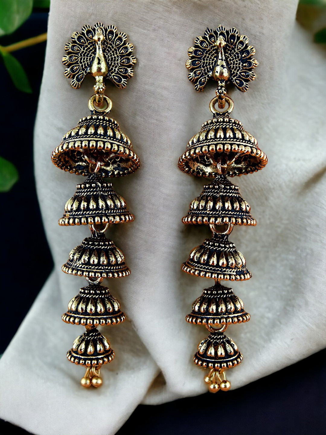 LUCKY JEWELLERY Gold-Plated Oxidised Peacock Shaped Layered Jhumkas
