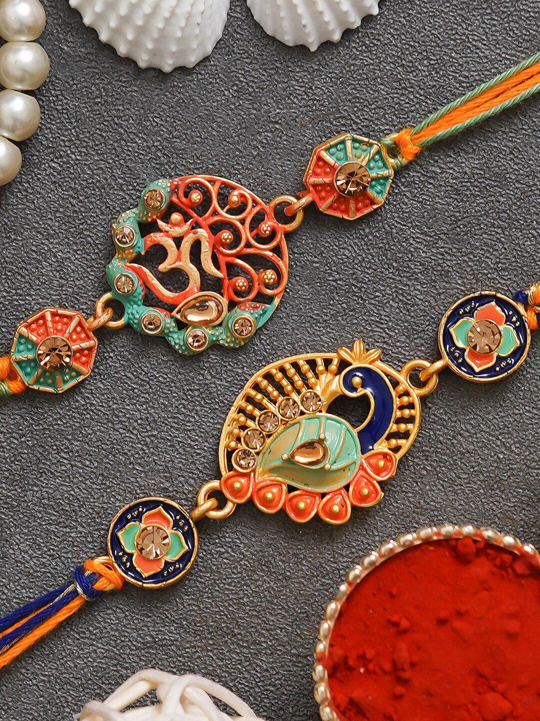 eCraftIndia Set of 2 Religious Om Symbol and Peacock Rakhi with Roli Chawal