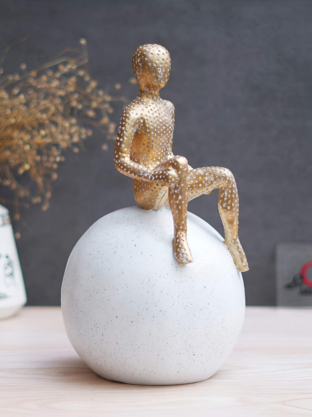 eCraftIndia Boy Sitting On Ball Gold Polyresin Natural Living Room Medium Showpiece - 11 Inches