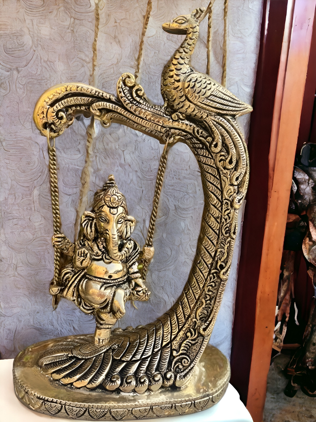 Aakrati Swing Ganesh Yellow Brass Metallic Prayer Room Medium Showpiece - 9.4 Inches