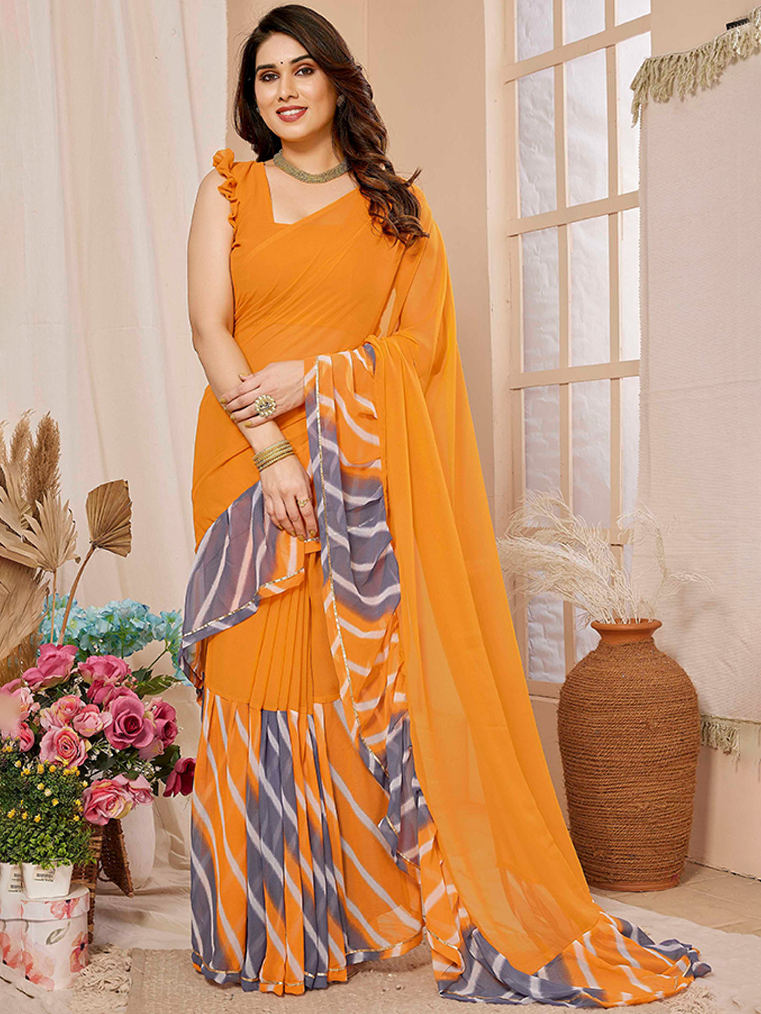 Mitera Orange Leheriya Printed Ruffles Saree