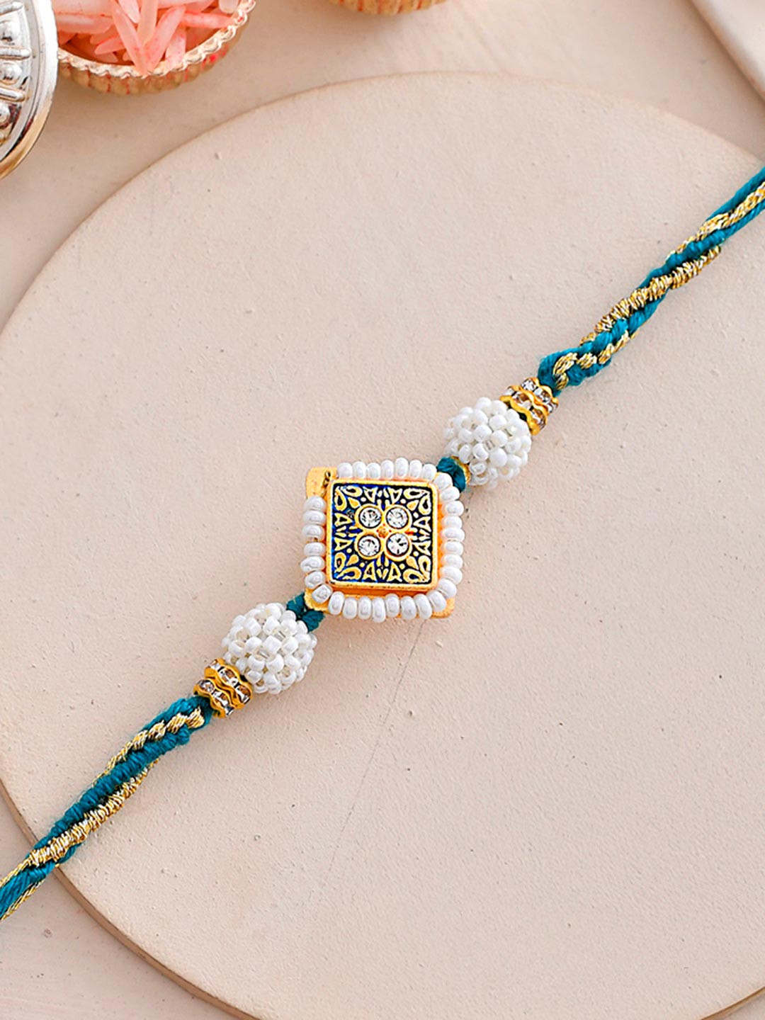Faux Pearls Embellished Thread Rakhi For Brother
