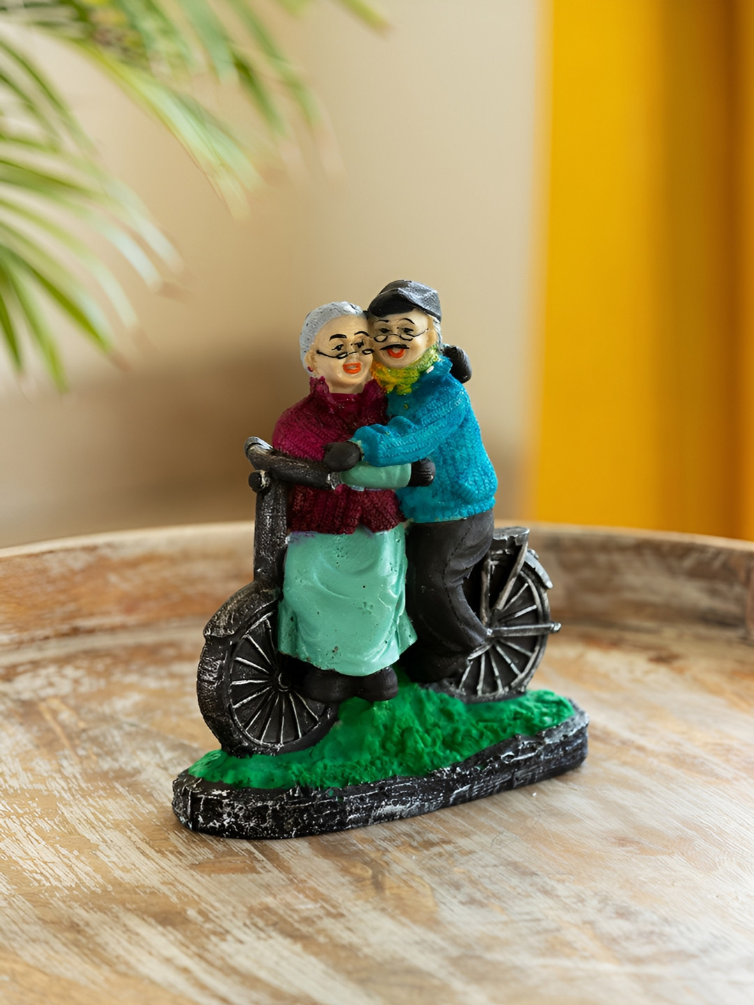 ExclusiveLane Italian Old Cycling Couple Blue Polyresin Natural Living Room Small Showpiece - 7.5 Inches