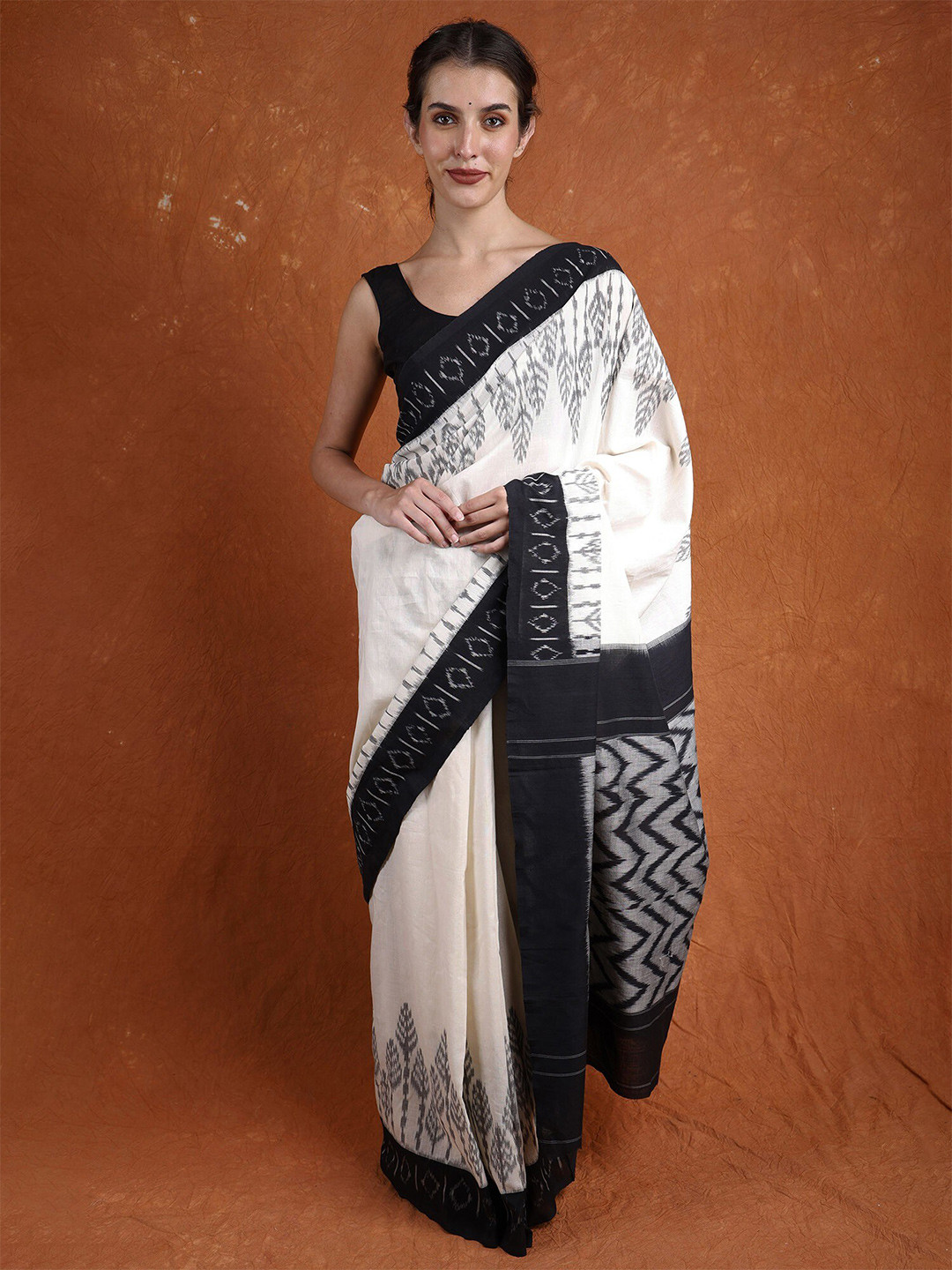 Exotic India Lucnet White and Black Ikat Woven Pure Cotton Puchampally Saree