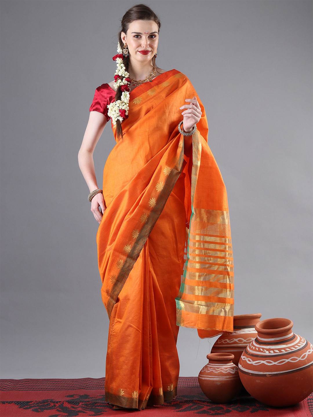 Exotic India Orange Golden Zari Woven Saree with Stripe Pallu and Lotus-Wave Motif Border