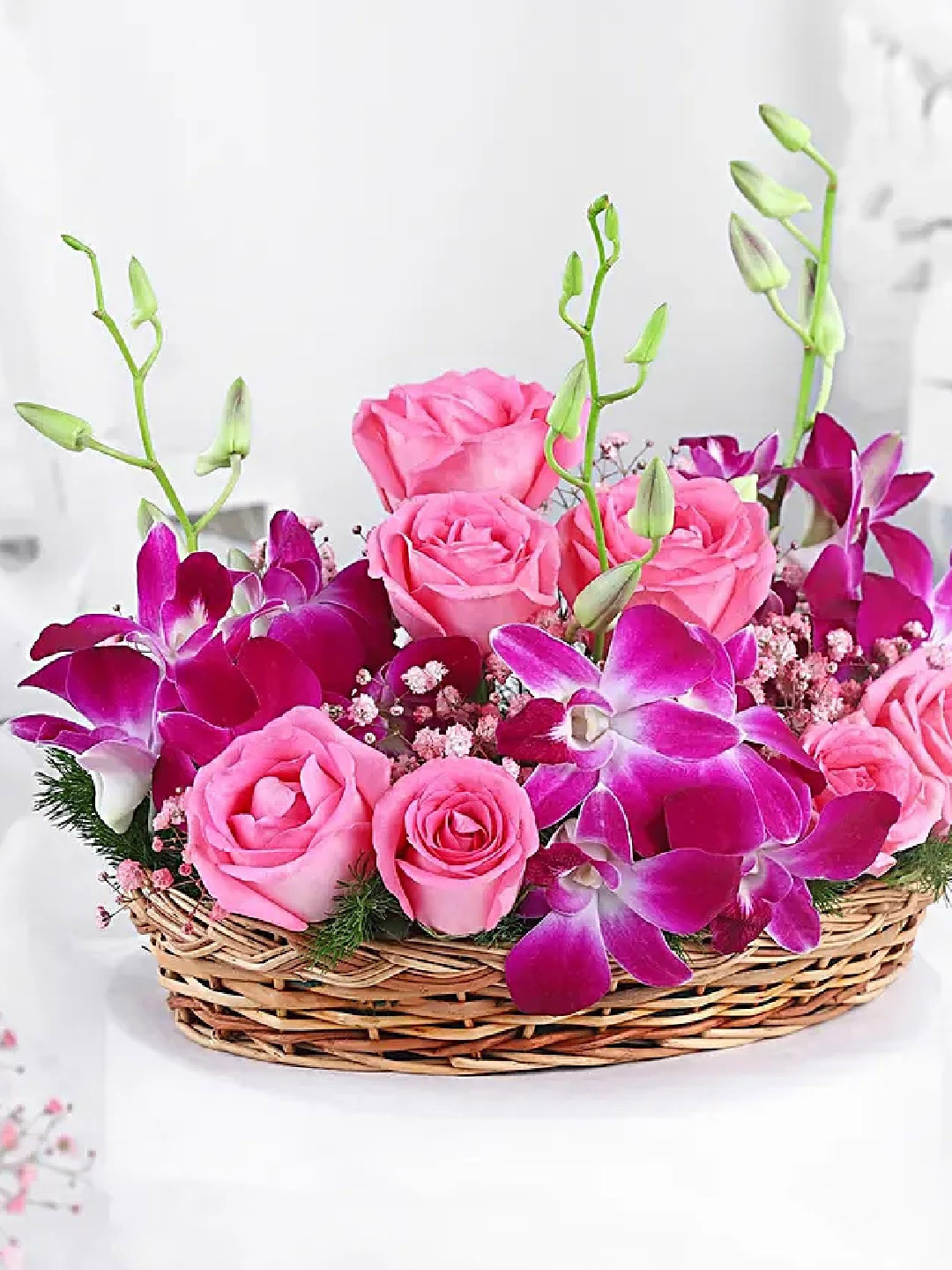 fnp 7 Pink Rose 2 Purple Orchid Flowers In Cane Basket
