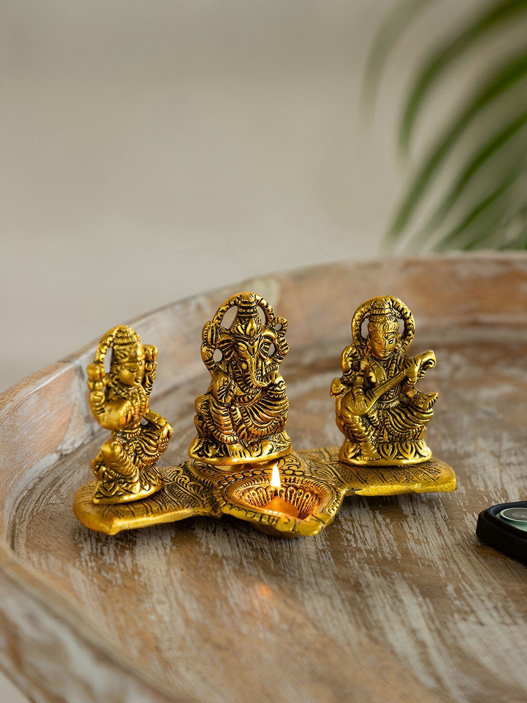 ExclusiveLane Laxmi Ganesh and Saraswati with Diya Gold Metal Metallic Prayer Room Hand-Crafted Tiny Showpiece - 3.7 Inches