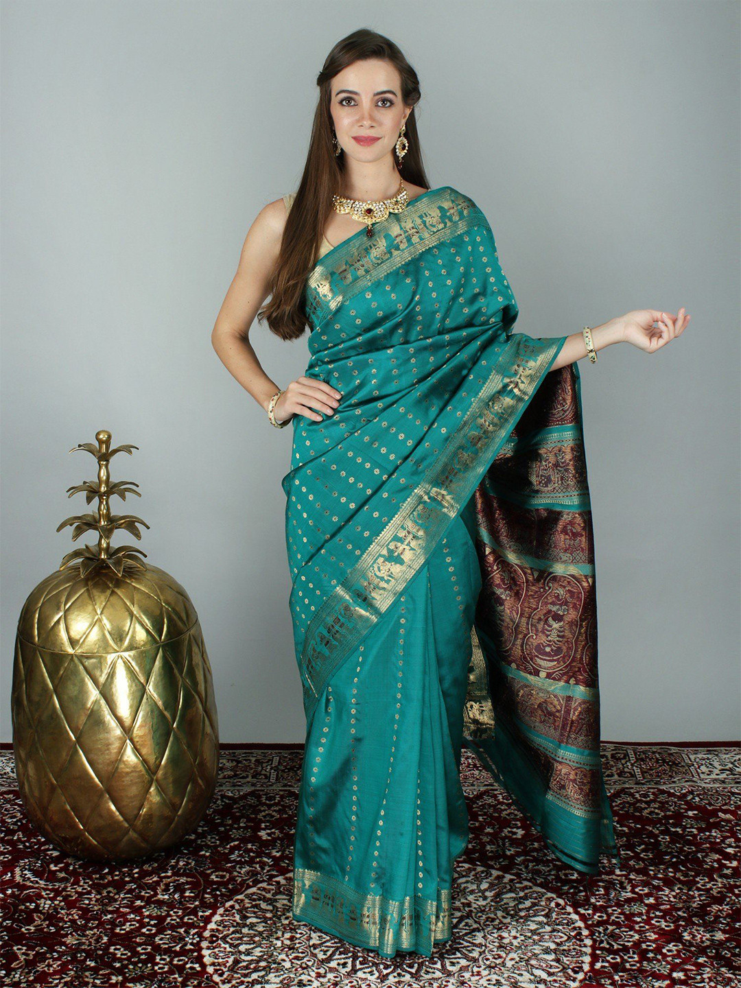 Exotic India Teal Blue Baluchari Saree with Exquisite Zari Work