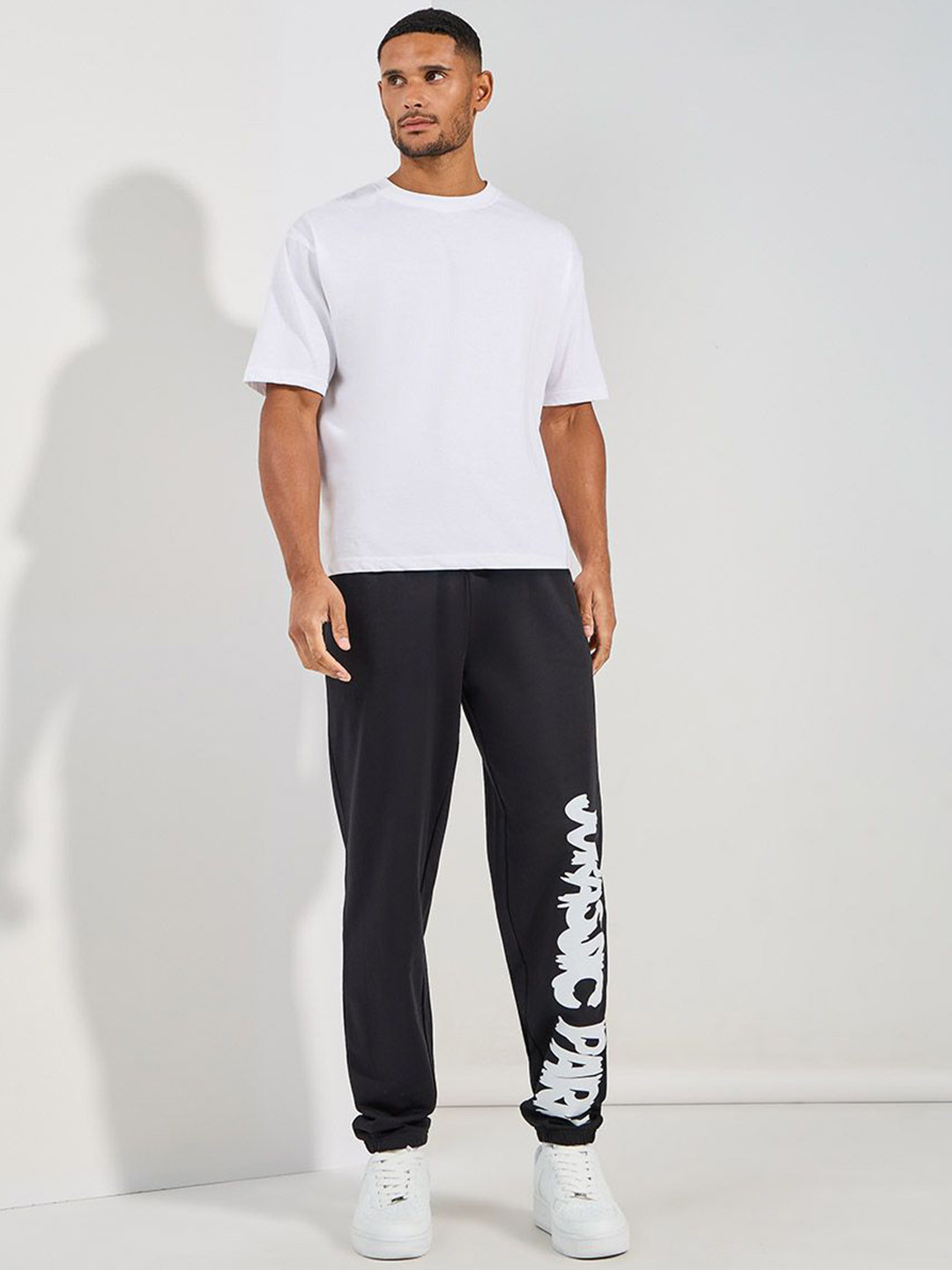 Styli Men Black Jurrasic Park Graphic print Oversized Open Hem Terry Joggers