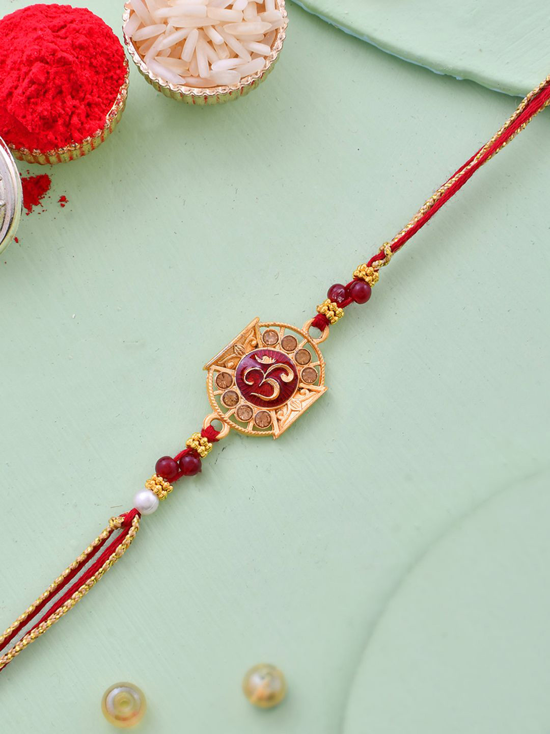 Aapno Rajasthan Om Designed Simple Stone Rakhi