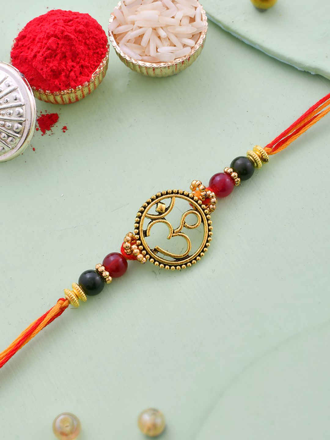 Aapno Rajasthan Om Designed Simple Thread Rakhi