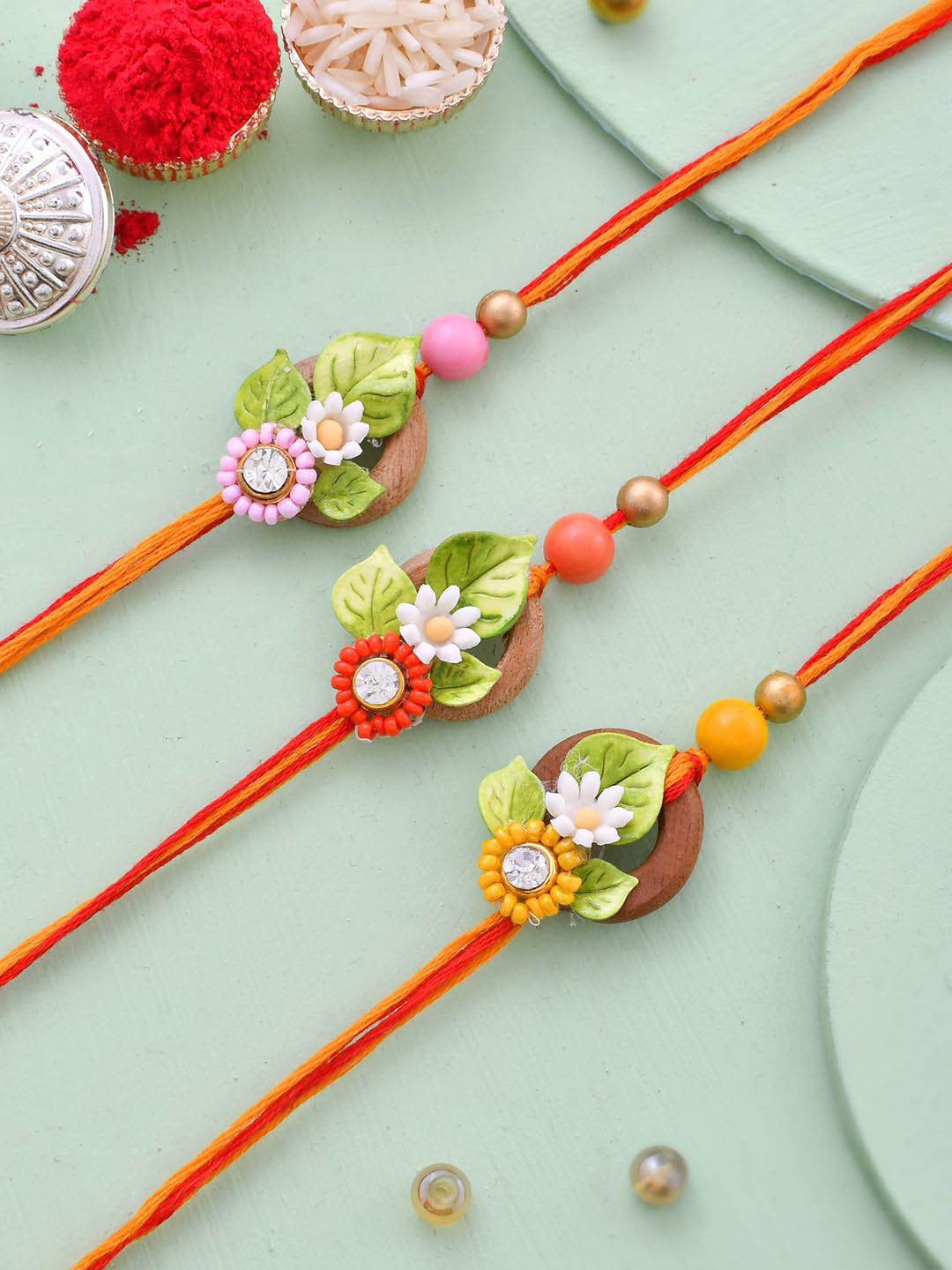 Aapno Rajasthan Unisex Set of 3 Floral Design Stone Work  Multistrand Rakhi