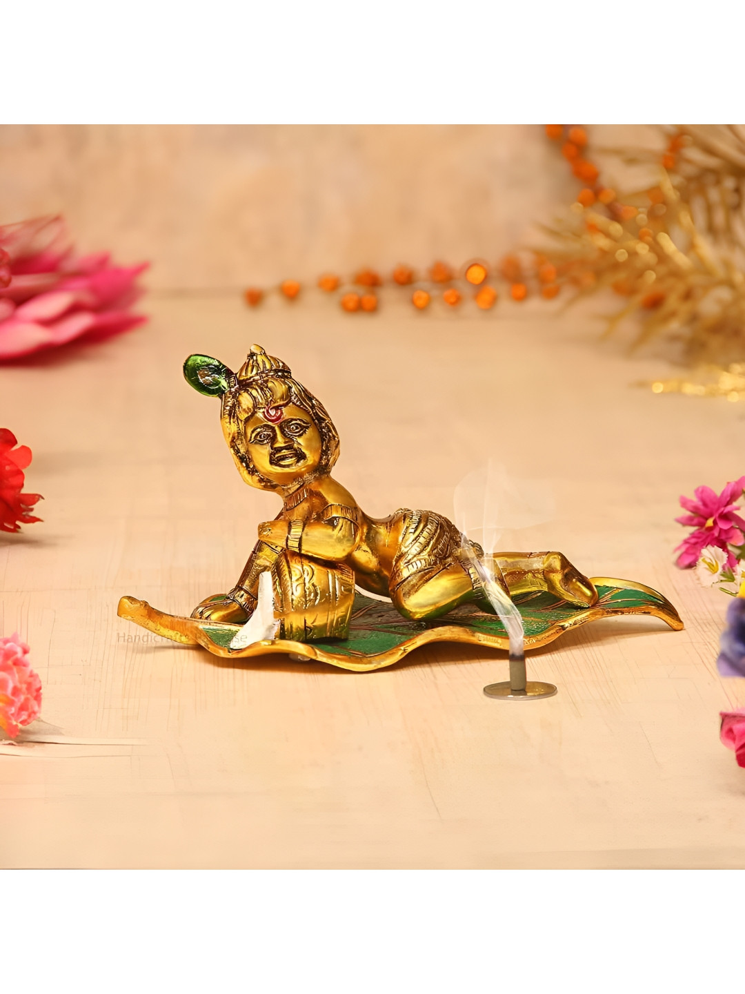 HANDICRAFTS PARADISE Bal Krishna Eating Butter on a Leaf Multicoloured Metal Metallic Prayer Room Small Showpiece - 4.5 Inches