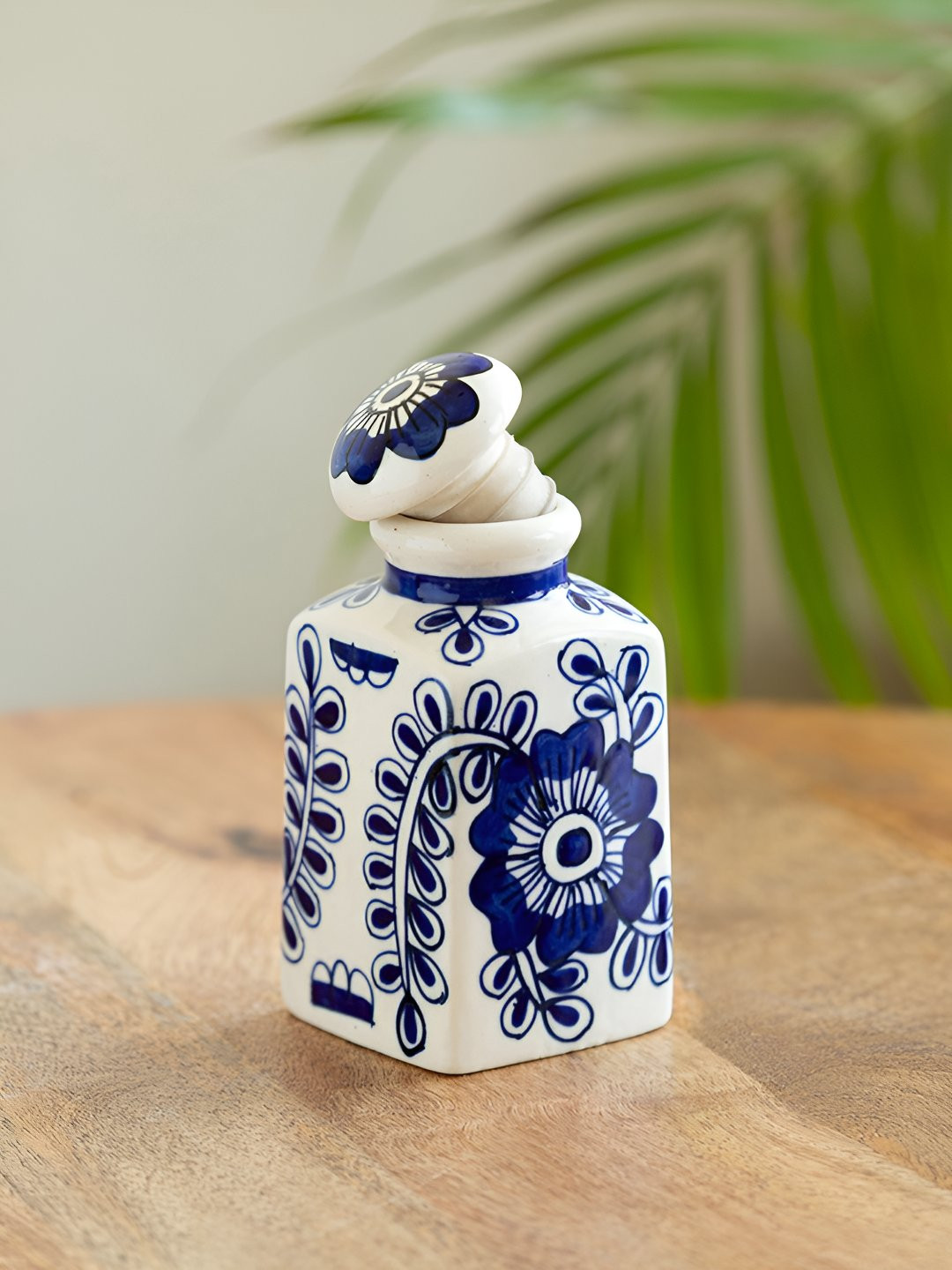 ExclusiveLane Mughal Gardens White & Blue Ceramic Ceramic Jar 220 ml