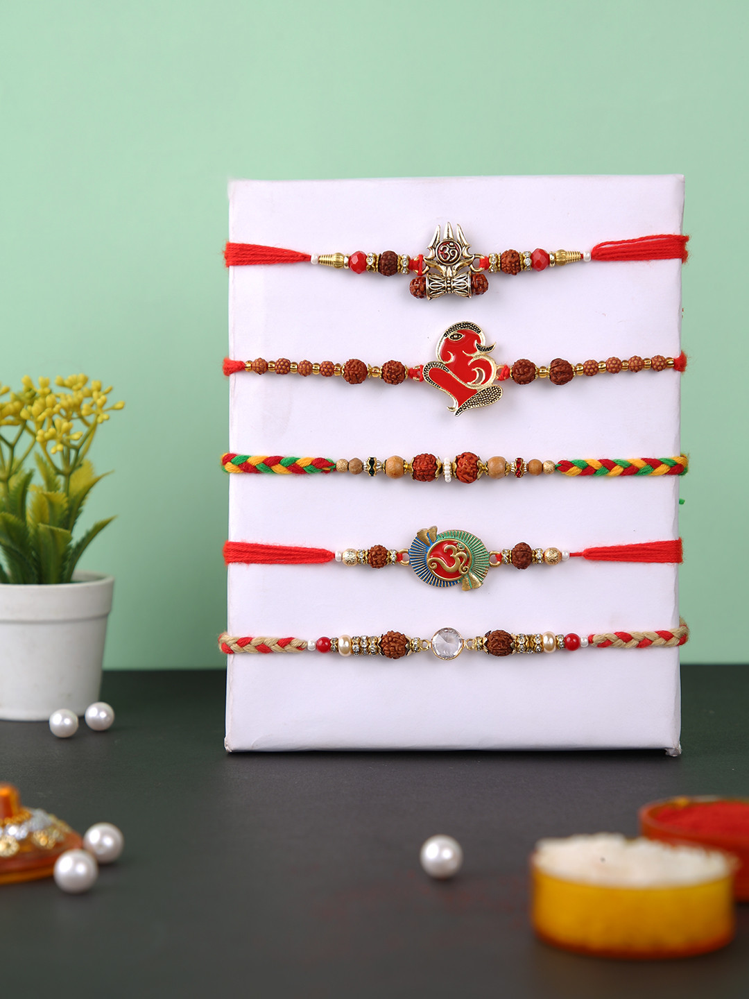 Aapno Rajasthan Set Of 5 Ganesha Shiva & Om Rudraksh Rakhi With Roli Chawal