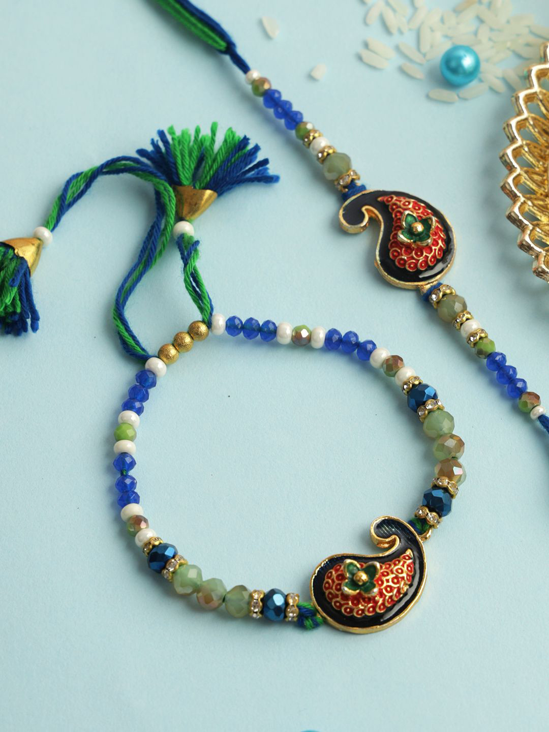 Aapno Rajasthan Set of 2 Mango Designed Thread Rakhi With Roli Chawal & Greetings Card