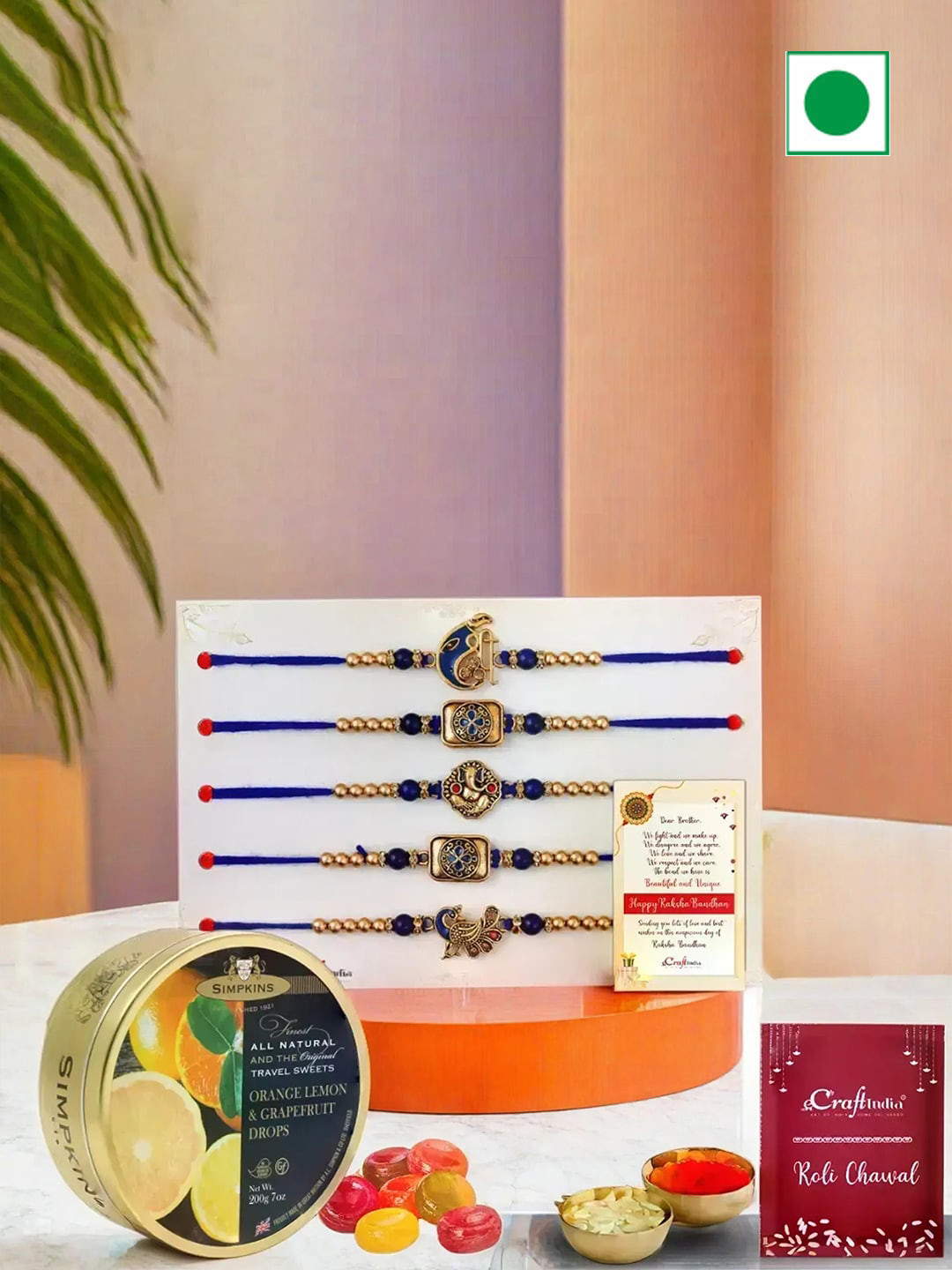 eCraftIndia Ganesha Peacock Flute Floral Rakhis With Drops Candy & Card With Roli Chawal