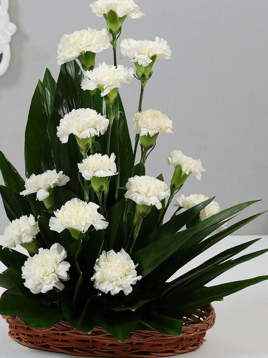 fnp White & Green 10 Pieces Carnation Flowers Cane Basket