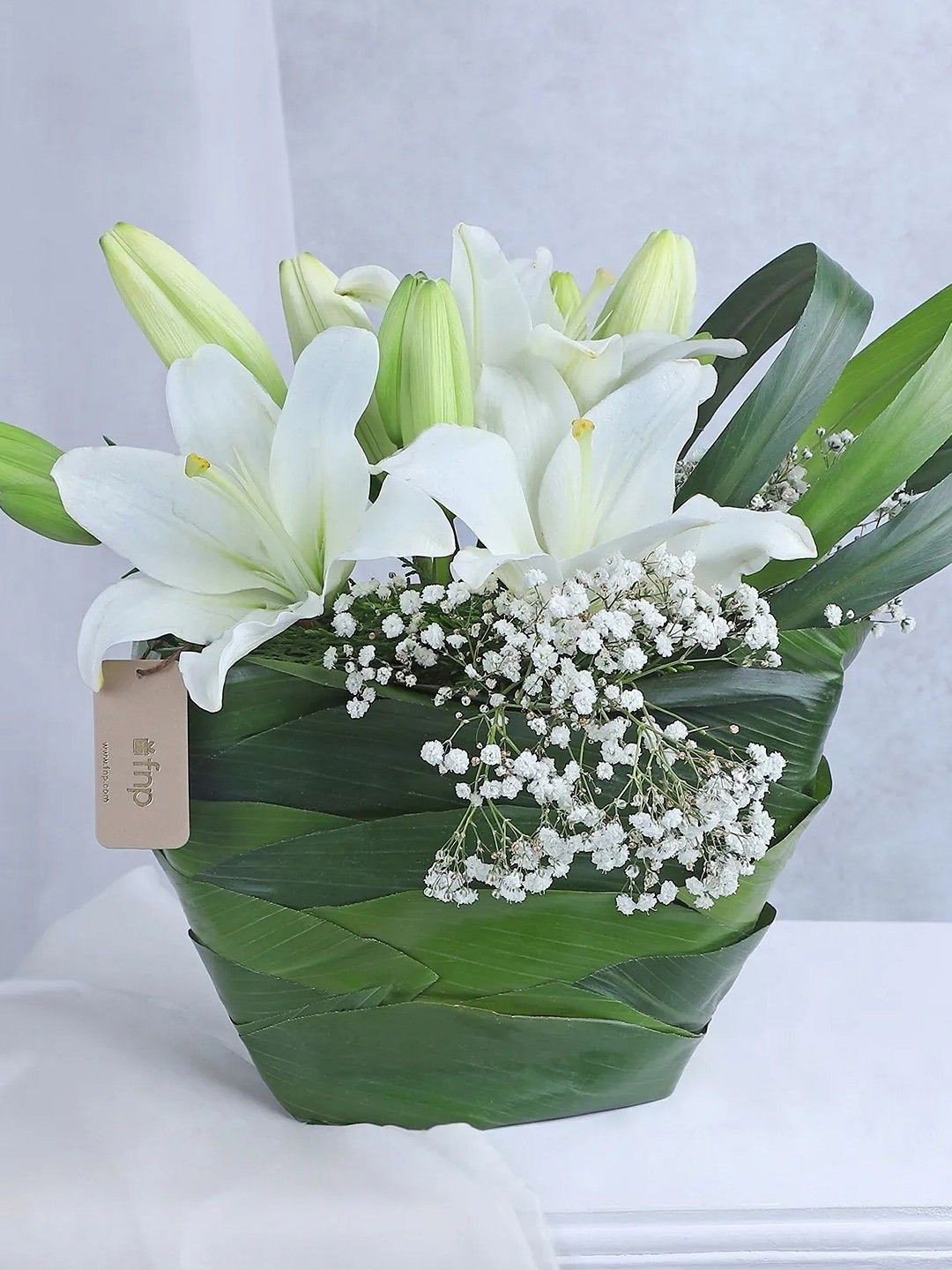 fnp White & Green 8 Pieces Lilies Fresh Flowers Basket
