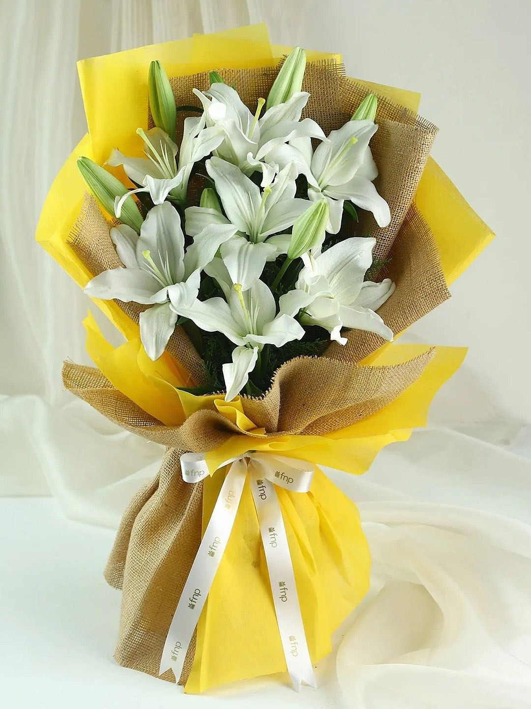 fnp White 7Pieces Lilies Angel Of Heaven Bouquet Fresh Flowers Bouquet