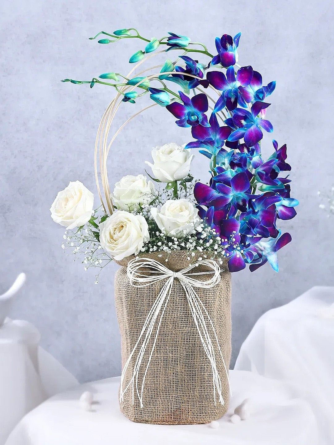 fnp White 9 Pieces Roses & Orchids Flowers Bouquet