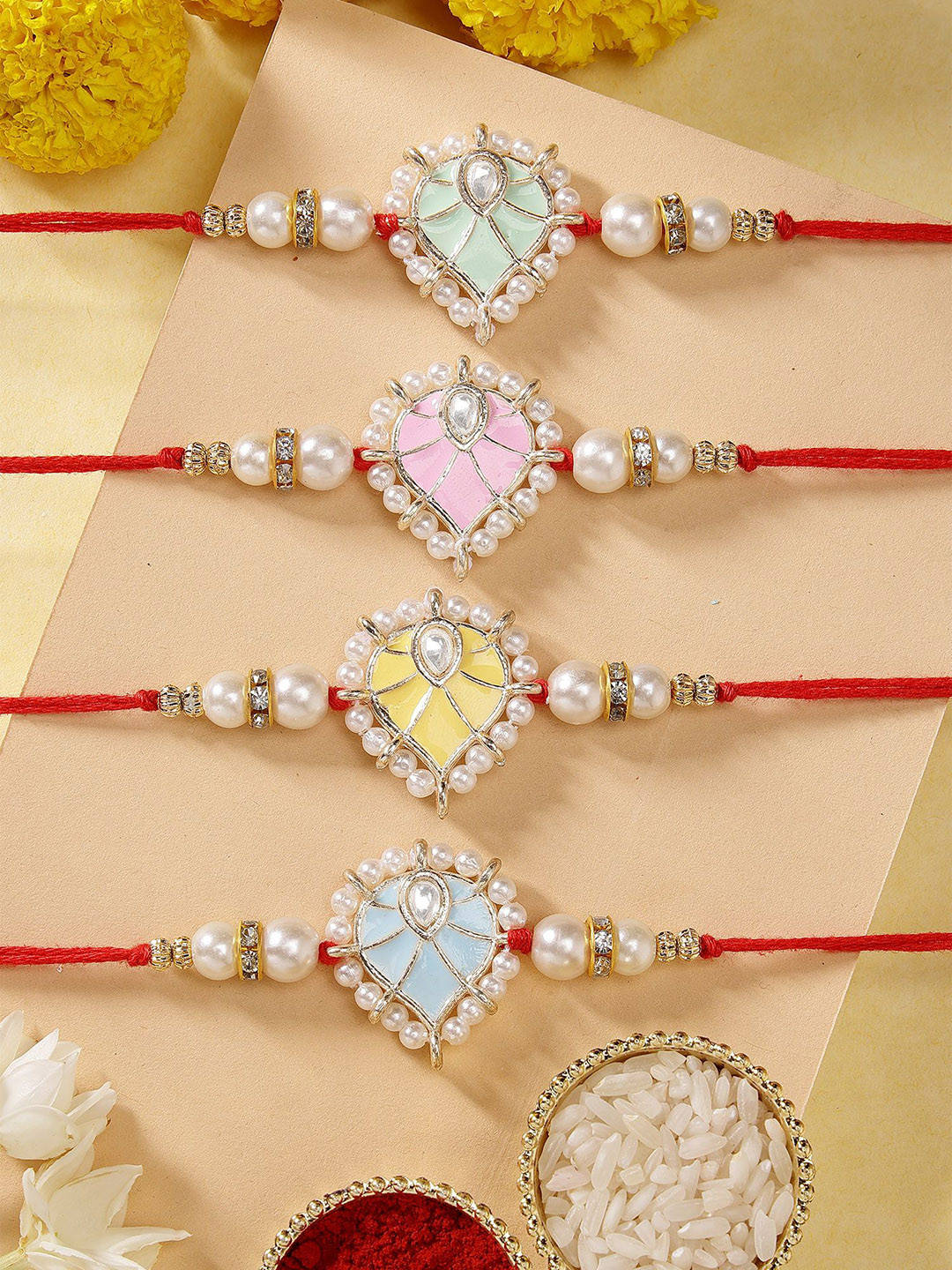 KARATCART Set of 4 Meenakari Heart Shape Kundan Rakhis with Roli & Chawal