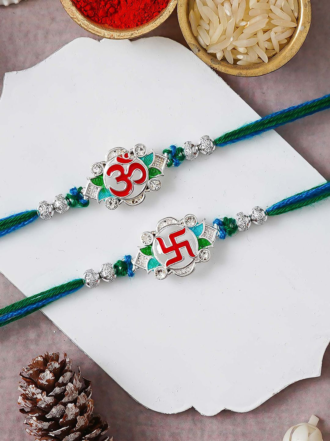eCraftIndia Set of 2 Swastika Om Symbol Design Thread Rakhis with Roli Chawal