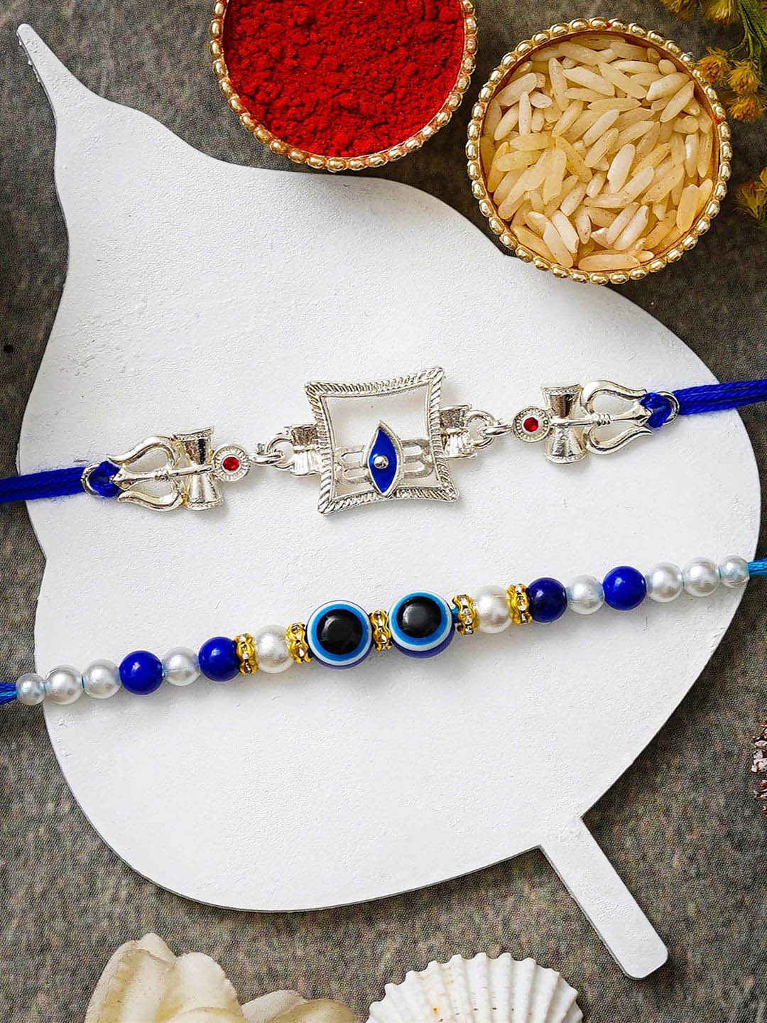 eCraftIndia Set Of 2 Shiva Third Eye Trishul Damru Evil Eye Rakhi With Roli Chawal