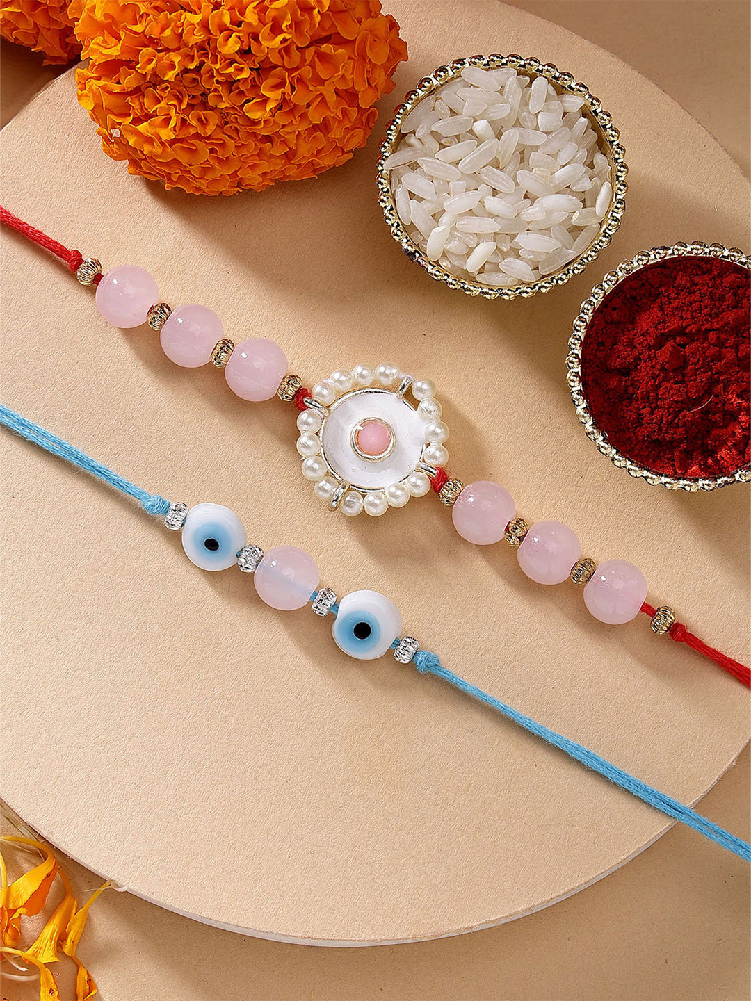 KARATCART Set of 2 Pink Beads Evil Eye Kundan Rakhi with Roli & Chawal