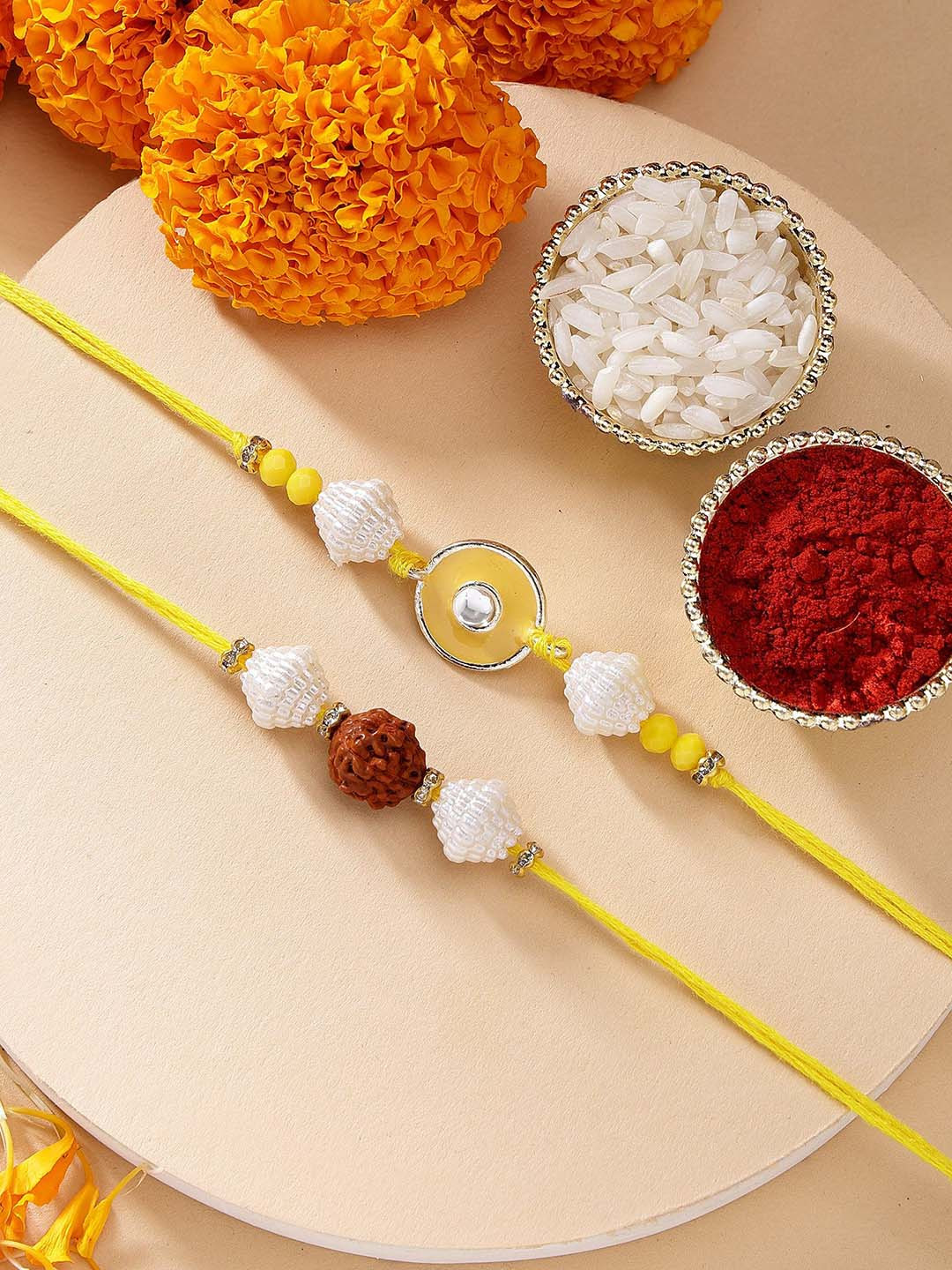KARATCART Set of 2 Yellow Evil Eye & Rudraksha Kundan Rakhi with Roli & Chawal