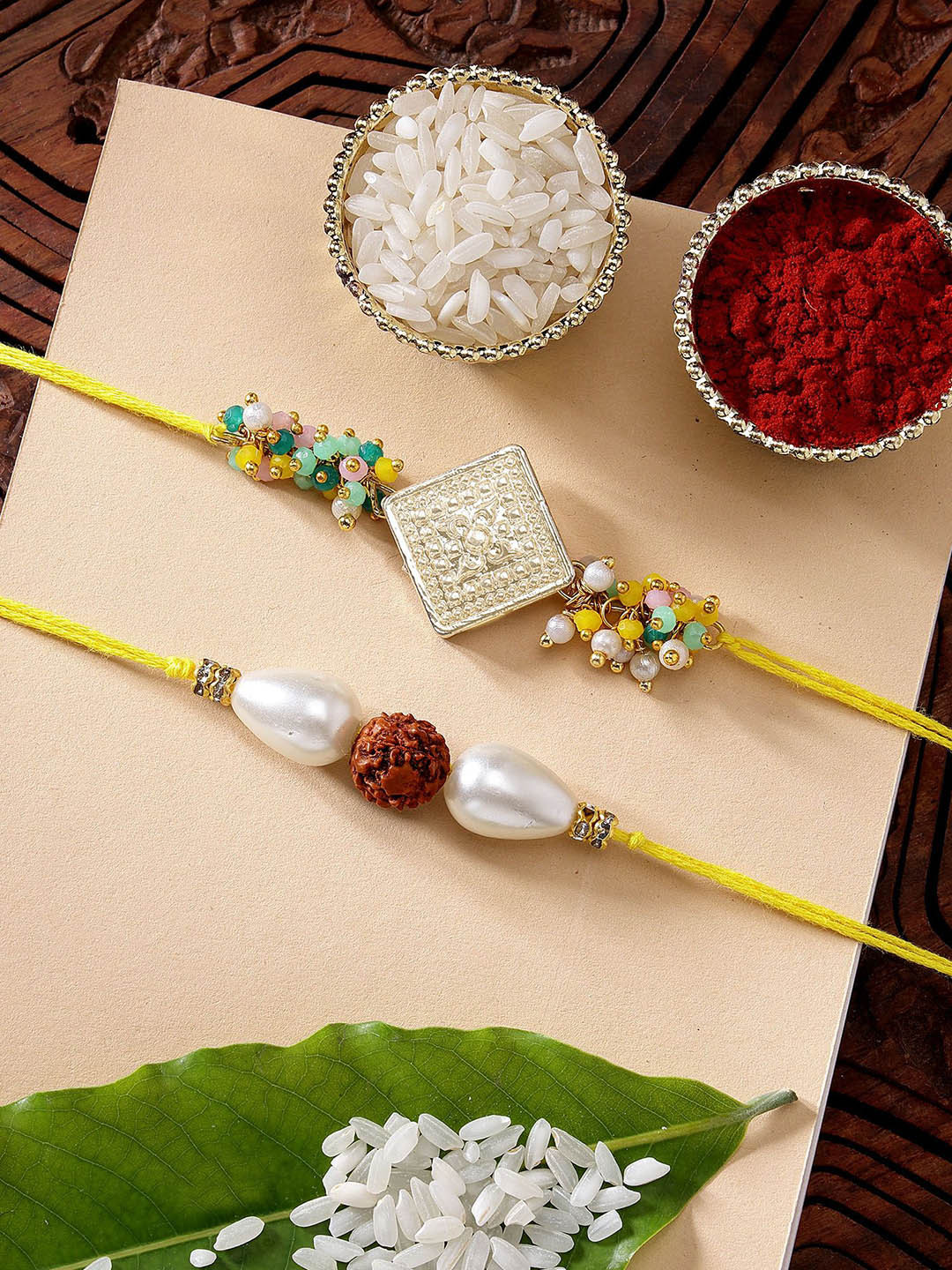 KARATCART Set of 2 Crystal & Rudraksha Kundan Rakhi with Roli & Chawal