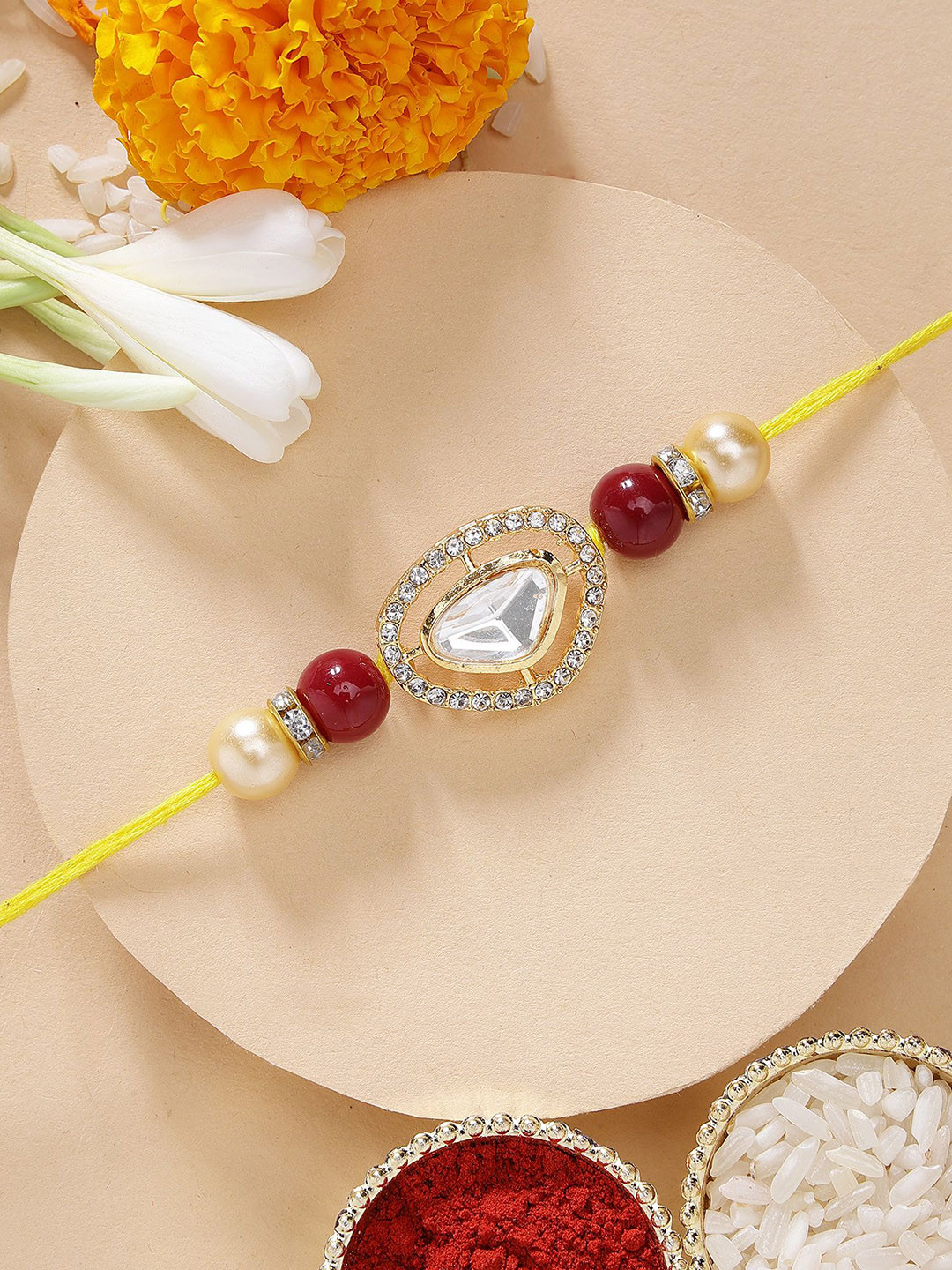 KARATCART Red Beads Polki Kundan Rakhi with Roli & Chawal