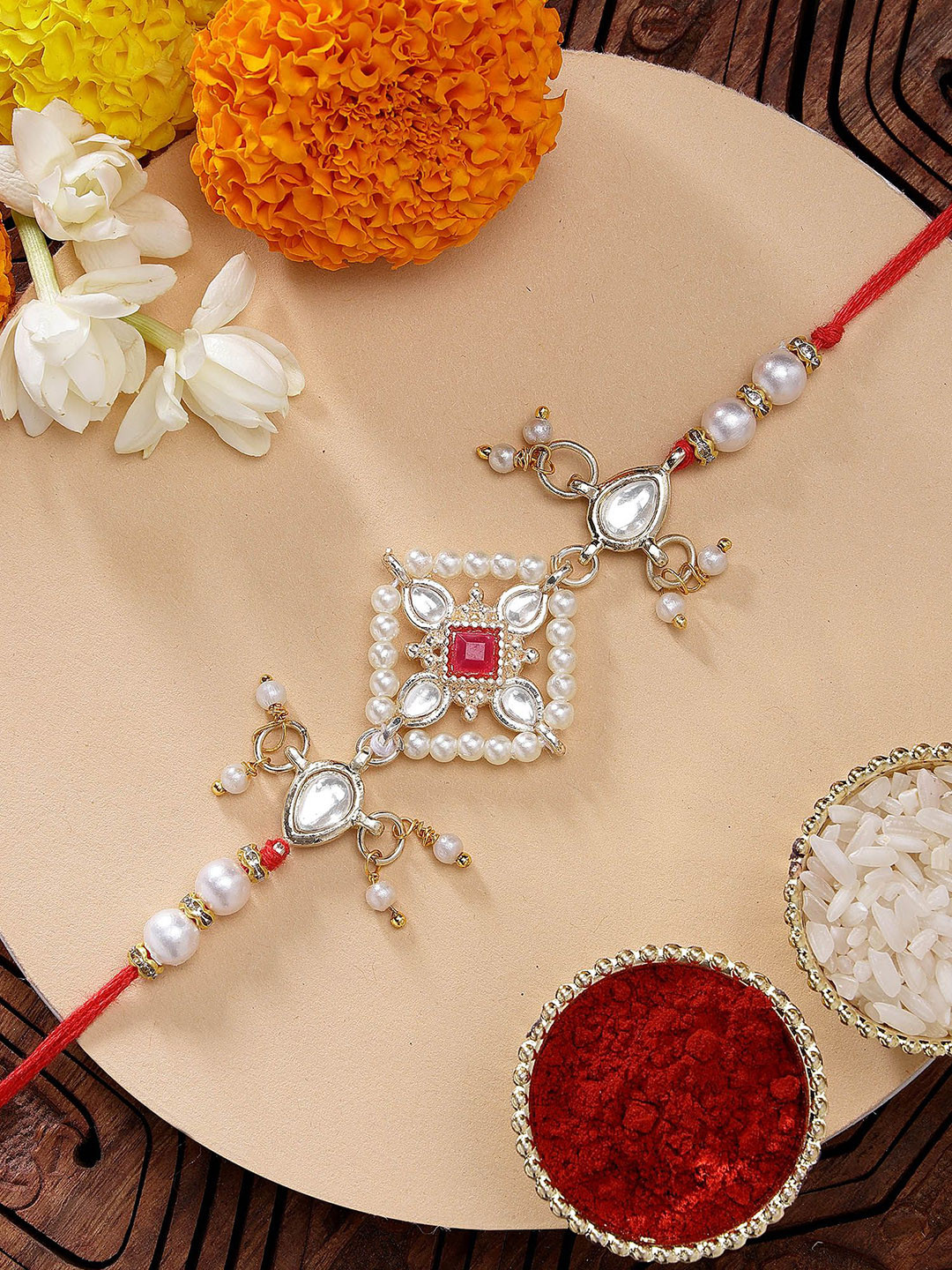 KARATCART Red Stone Floarl Kundan Rakhi with Roli & Chawal