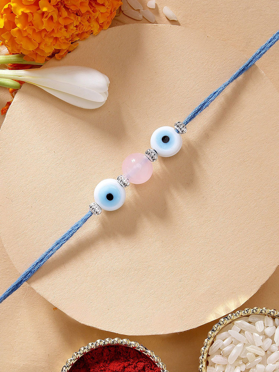 KARATCART Pink Bead Evil Eye Rakhi with Roli & Chawal