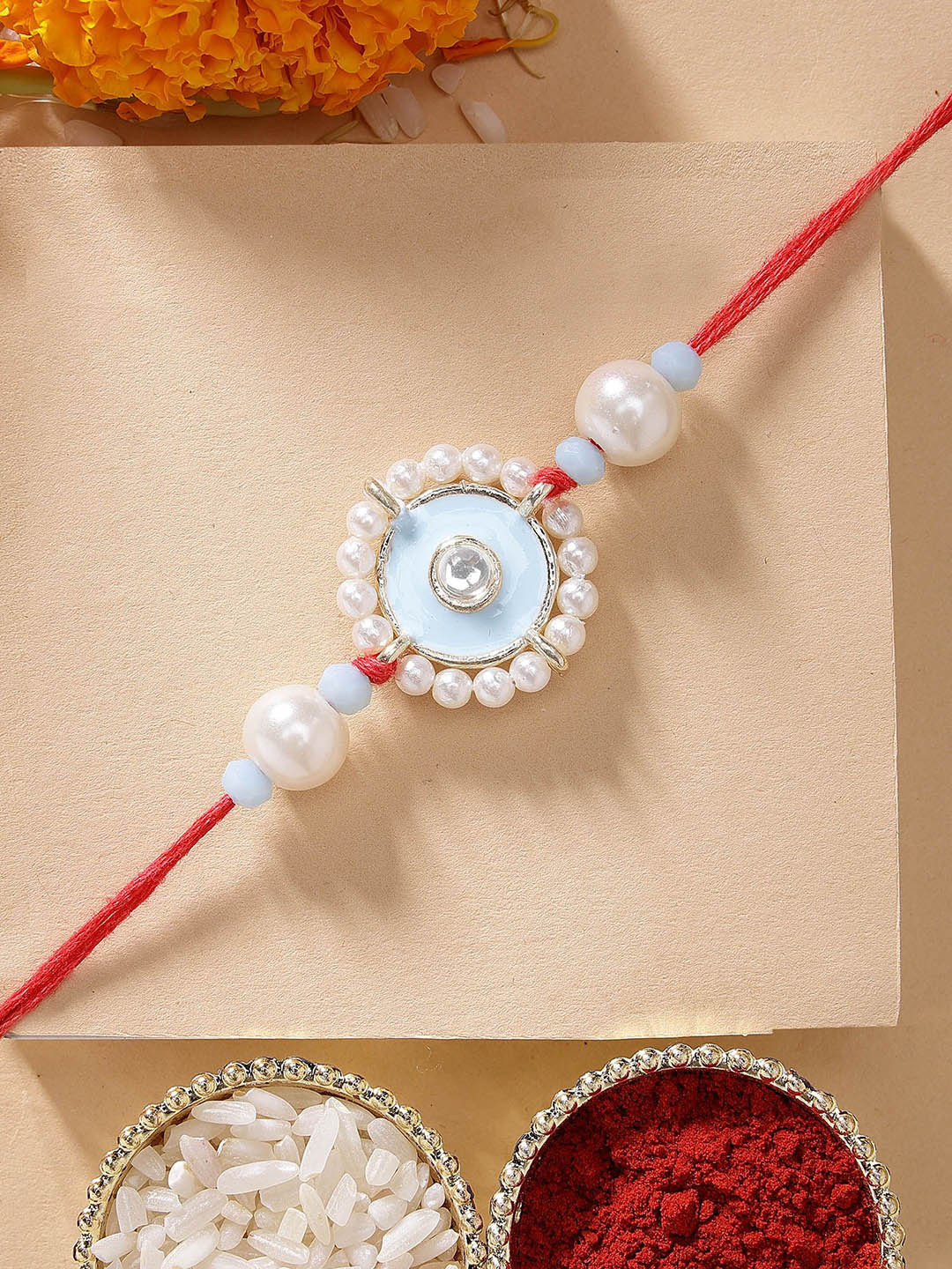 KARATCART Blue Meena Evil Eye Design Kundan Rakhi with Roli & Chawal
