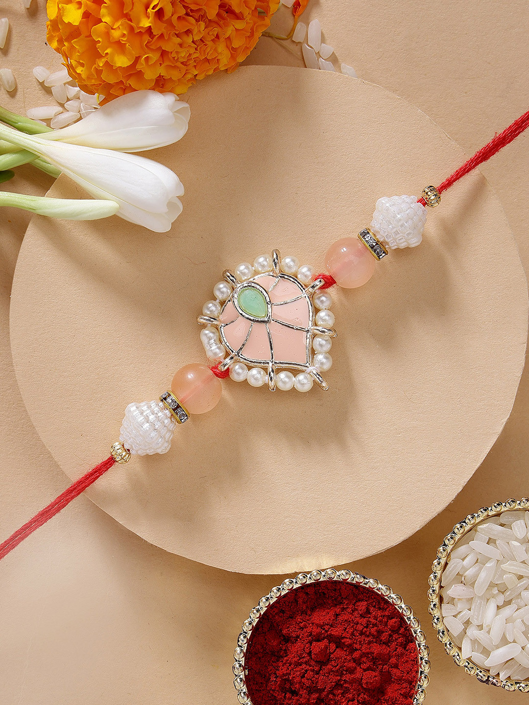 KARATCART Peach Meenakari Heart Shape Kundan Rakhi with Roli & Chawal