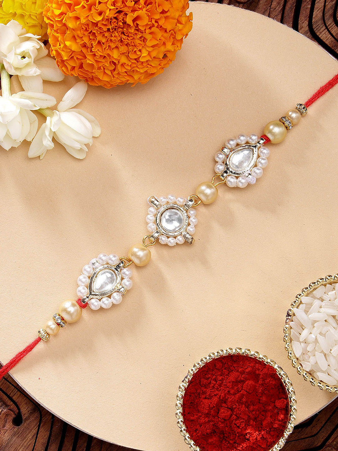 KARATCART Golden Pearls & Kundan Rakhi with Roli & Chawal
