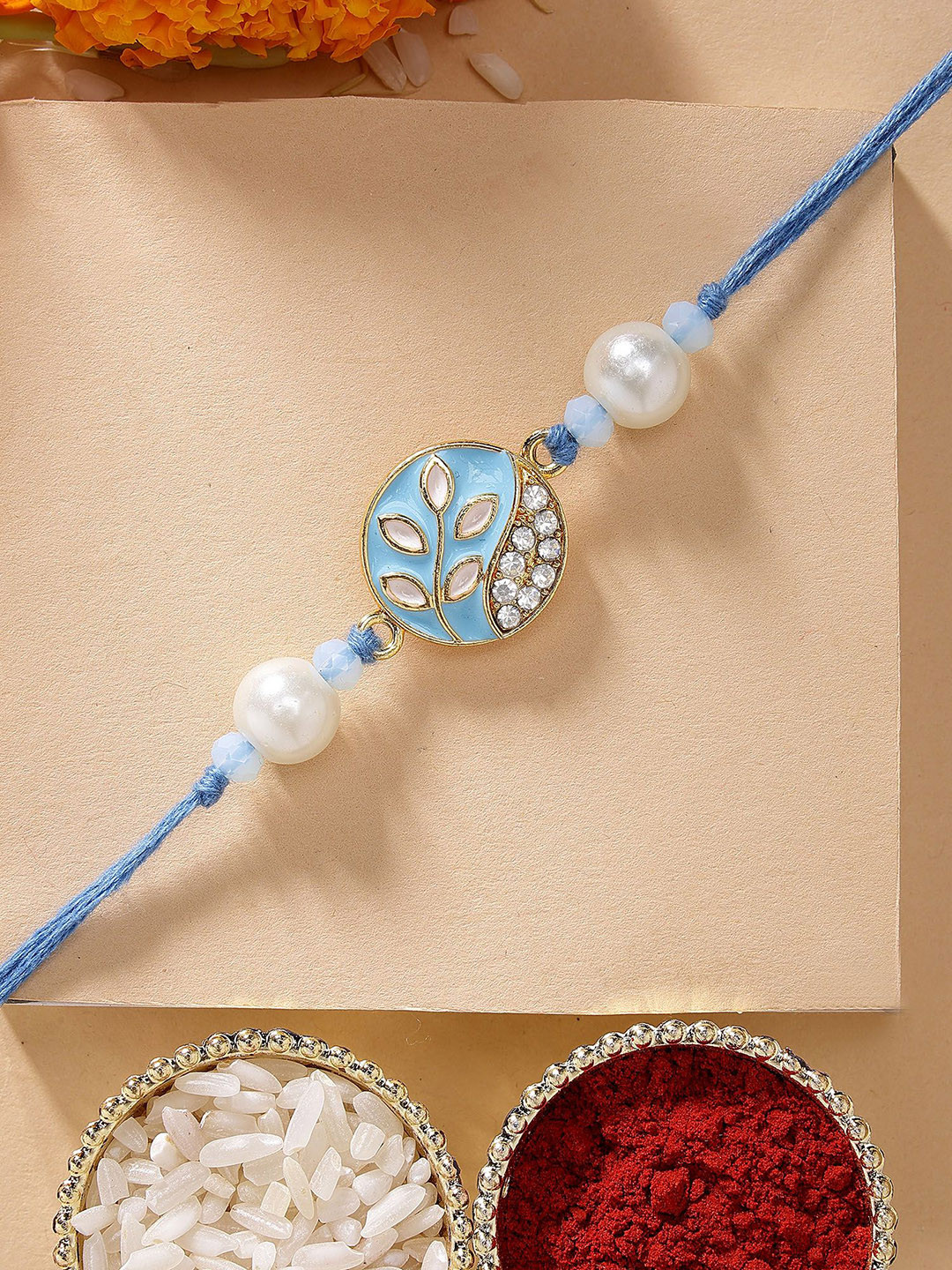 KARATCART Blue Meena Leaf Design Kundan Rakhi with Roli & Chawal