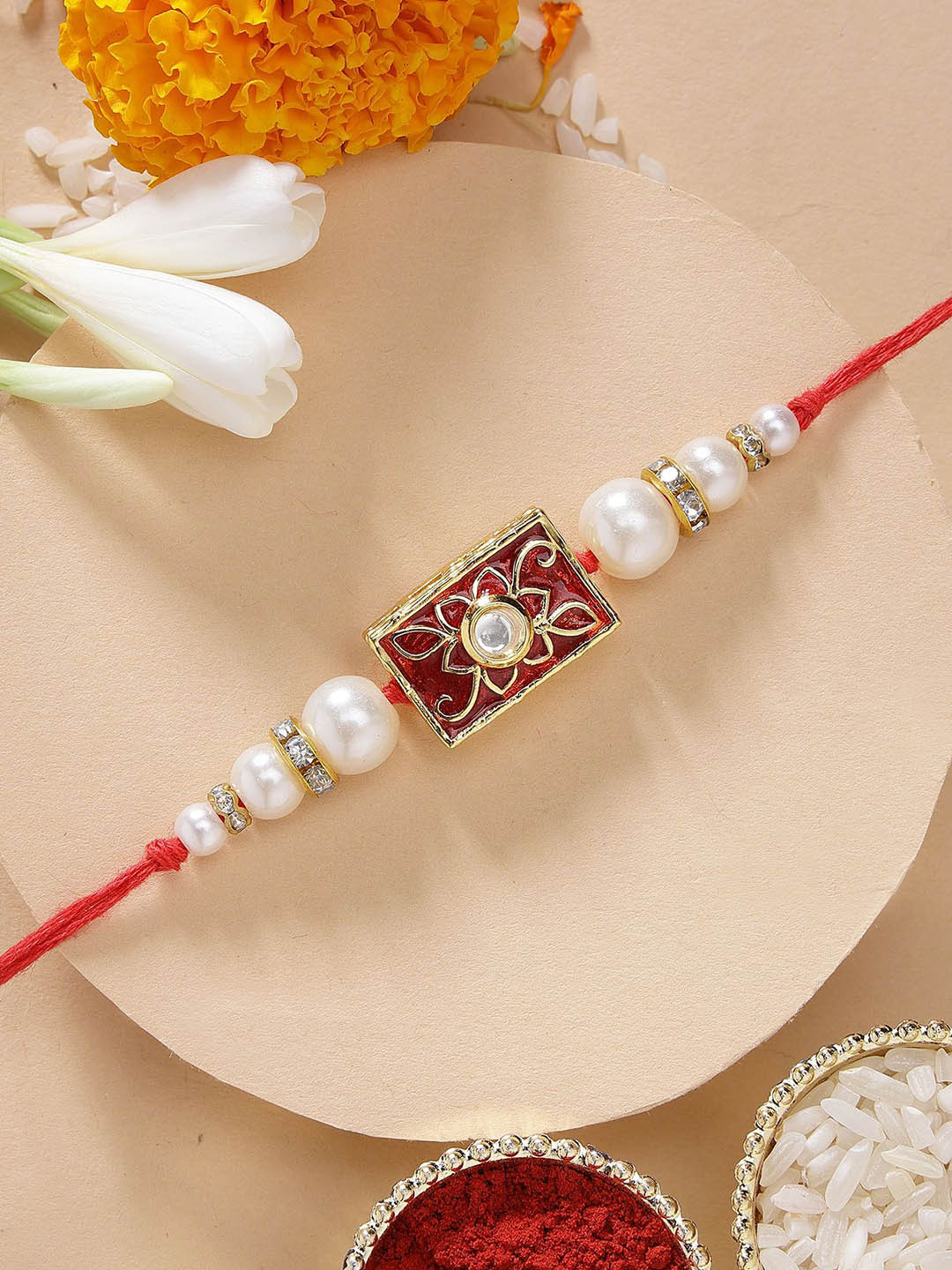 KARATCART Red Meena Weight Kundan Rakhi with Roli & Chawal