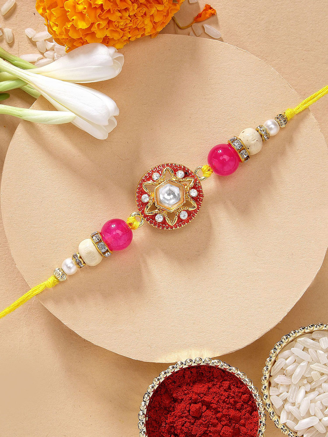 KARATCART Floral Design Pink Meena Kundan Rakhi with Roli & Chawal